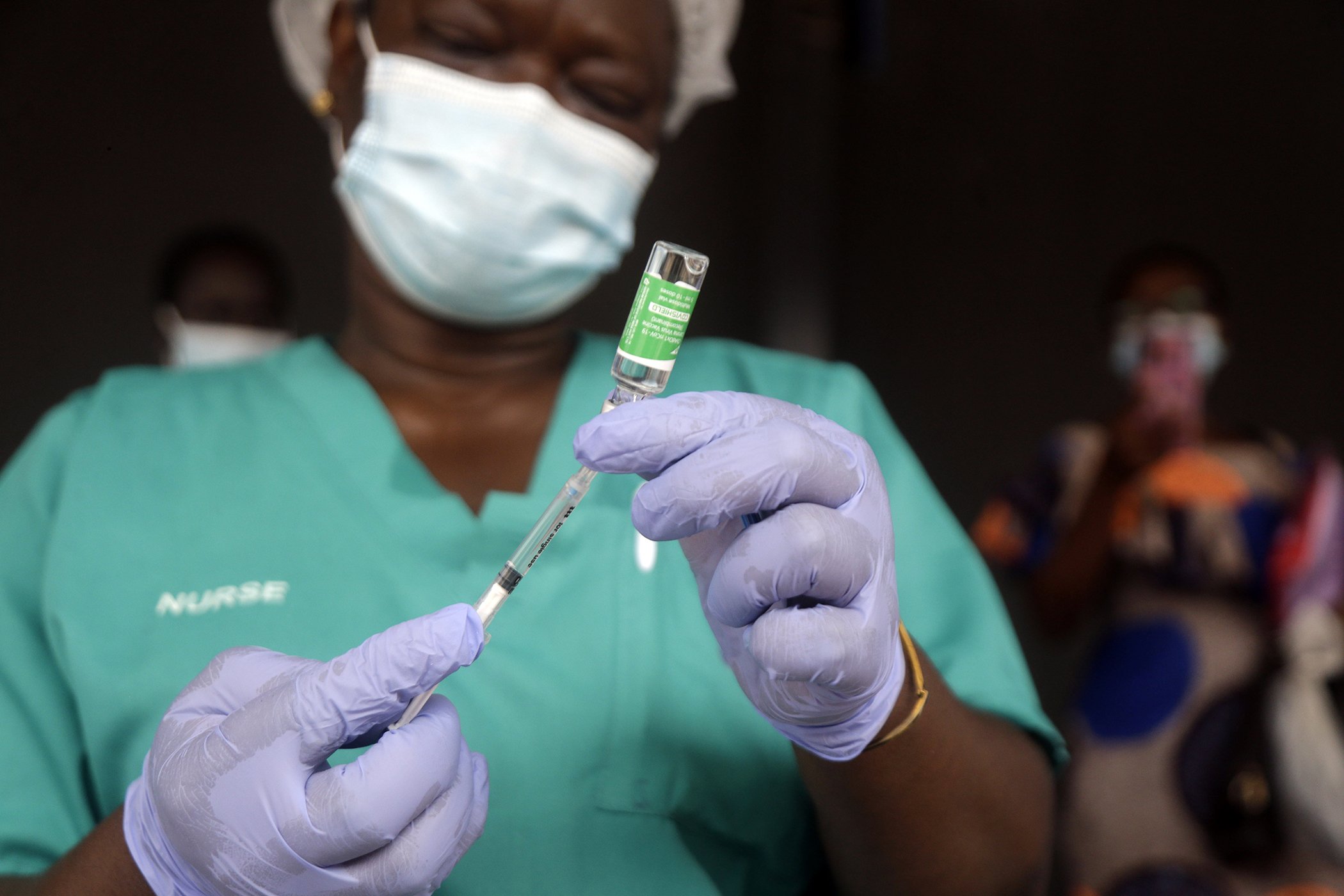A nurse prepares one of the country's first COVID-19 vaccinations, provided through the global COVAX initiative, at Mainland Hospital Yaba in Lagos, Nigeria on March 12, 2021.