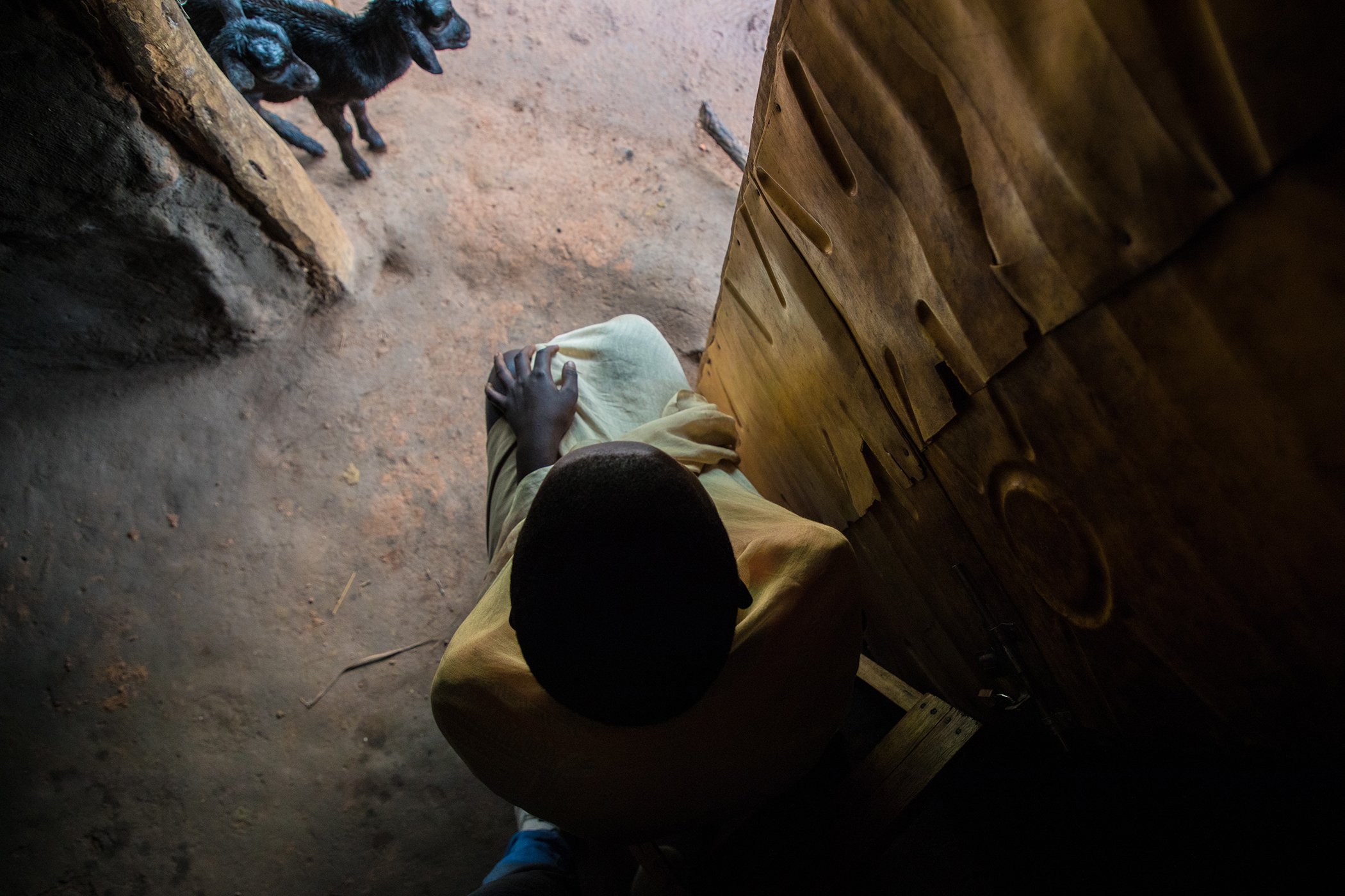 A portrait of a teenager, who was married as a child, in her parents’ home in Uganda, December 2020. COVID-19 will disrupt efforts to end child marriage, according to UNFPA — and could result in 13 million more child marriages between 2020 and 2030.