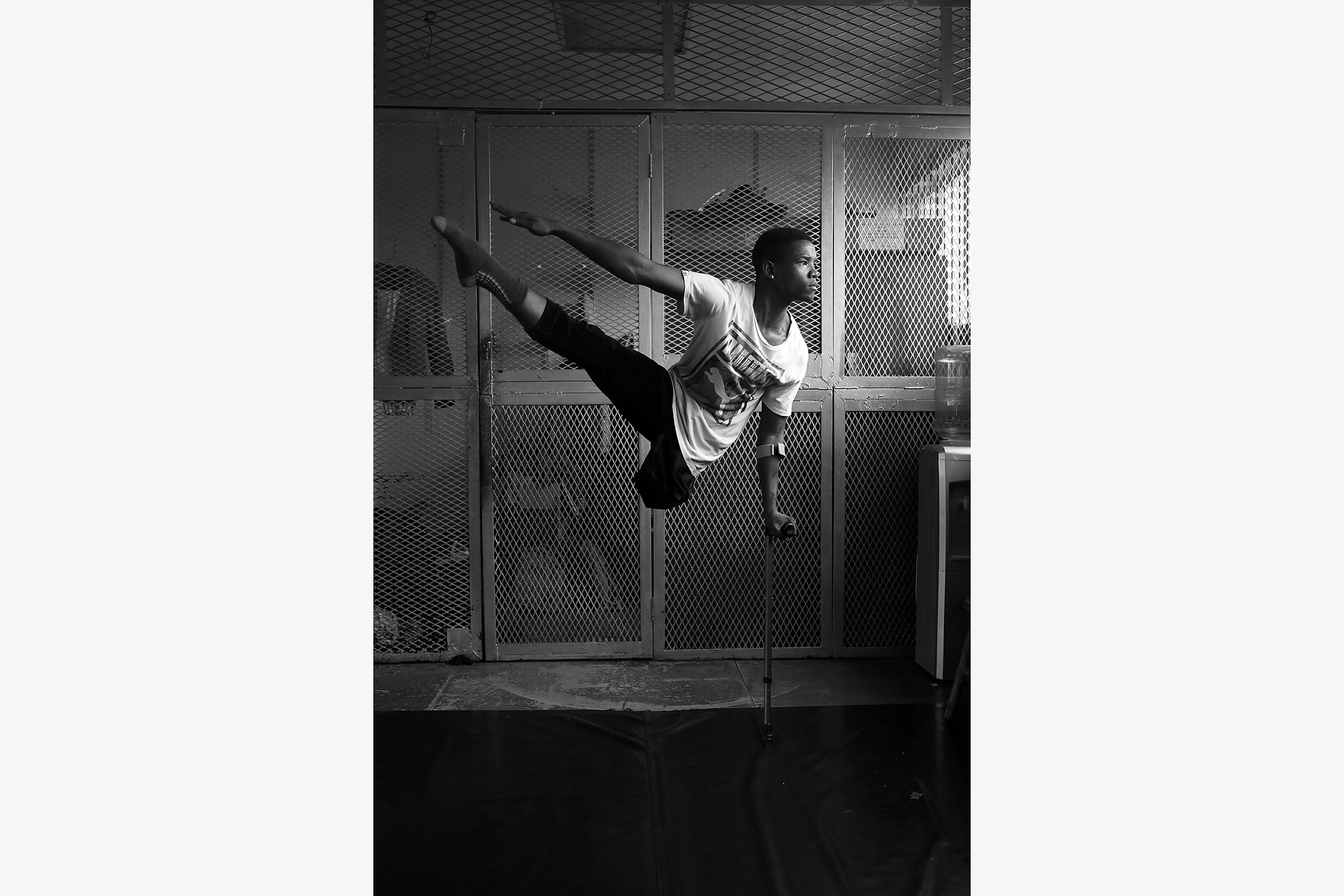 Musa’s Struggle and Search for the Stage: Professional dancer Musa Motha, who dances on crutches, poses after a practice session in Newtown, Johannesburg, South Africa. Nominated in the portrait singles category.