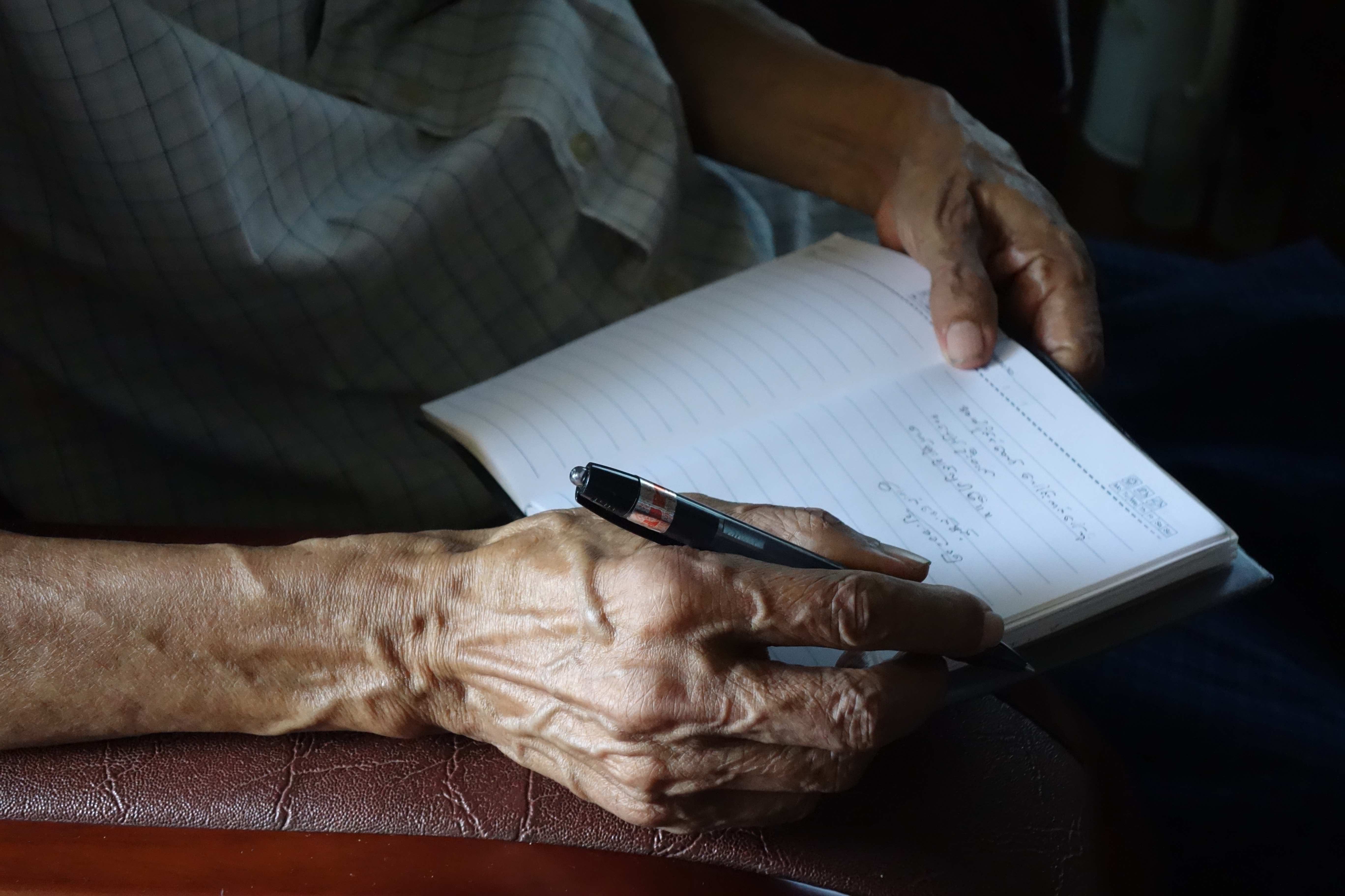 Hands of Maung Aung Pwint, dissident poet.