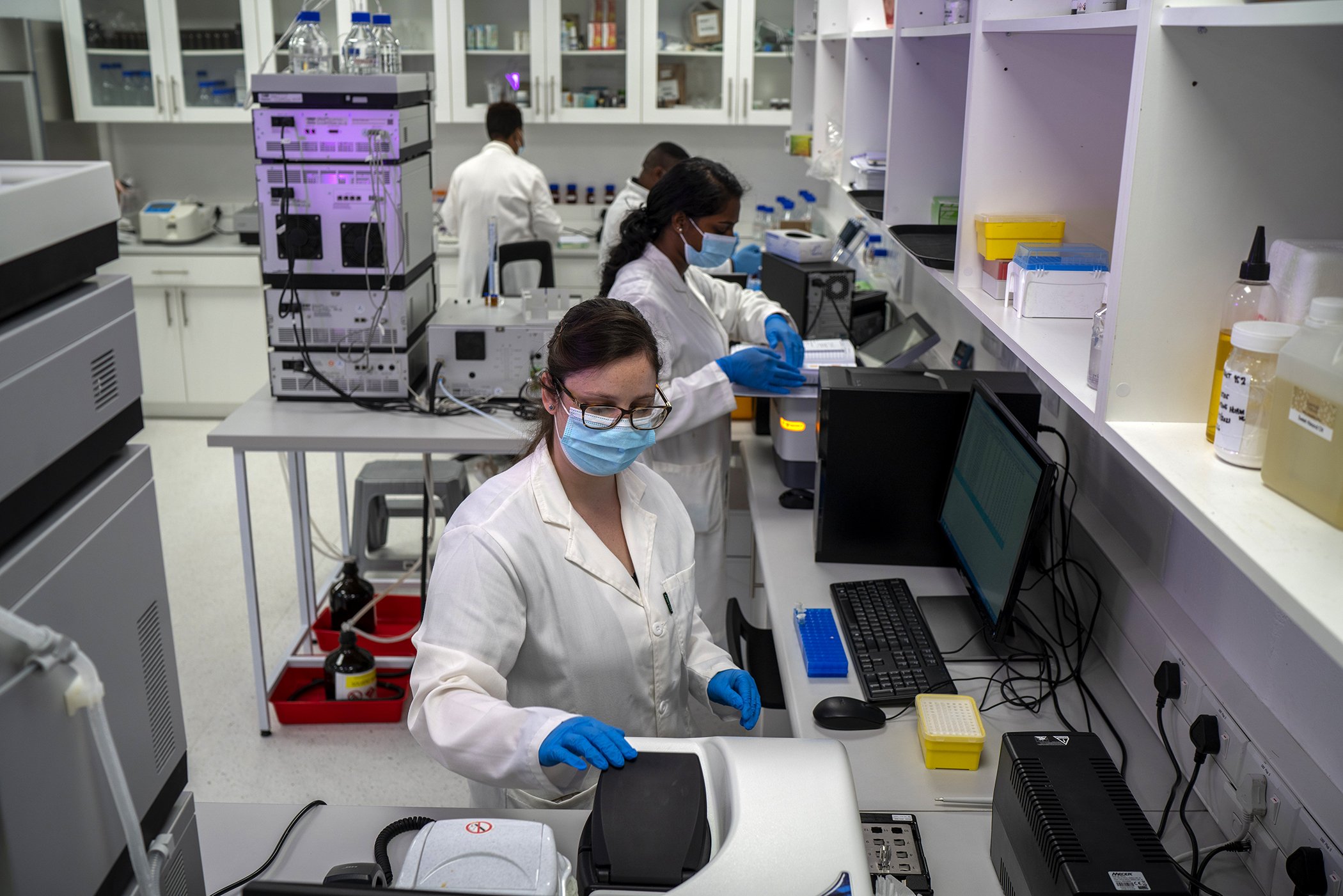 Scientists conduct research at an Afrigen Biologics and Vaccines lab in Cape Town, South Africa on Oct. 19, 2021.