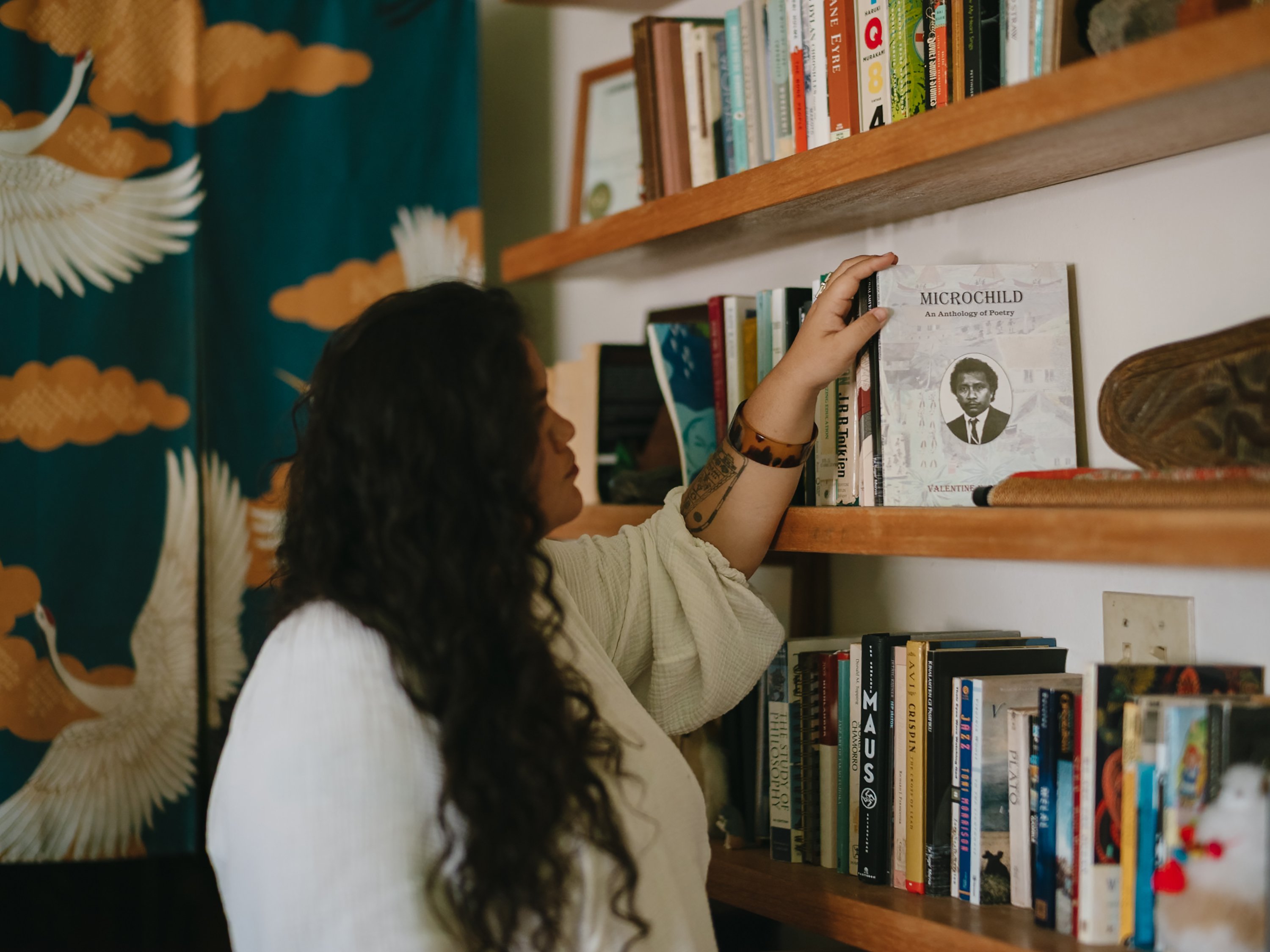 Siobhon displays Microchild, a collection of poetry written by her grandpa's brother reflecting on Palau’s violent struggle for independence from the US. She read the book when she was 19 years old, a time where advocacy became more personal for her.