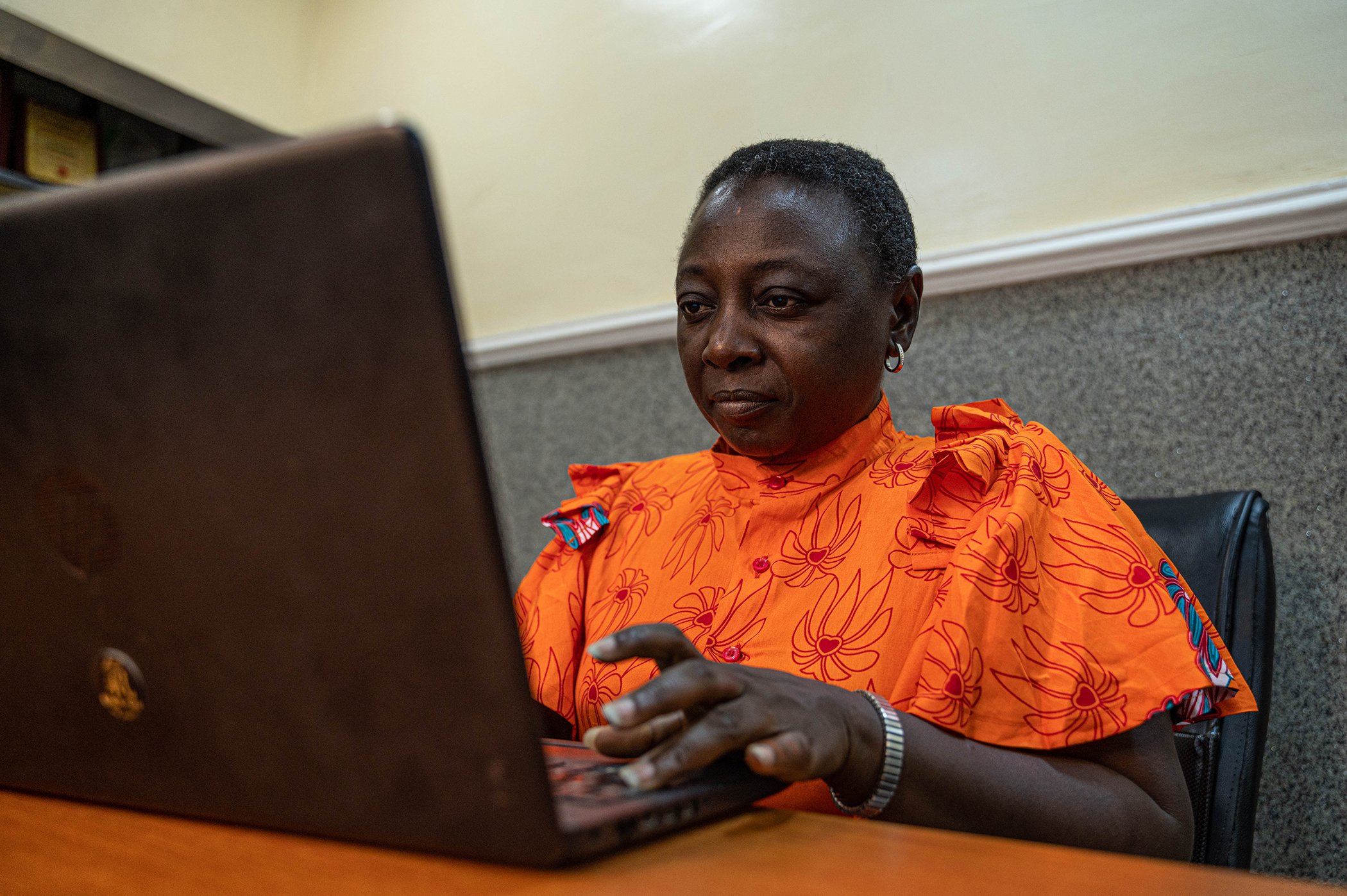 Lois Auta works from home in Abuja, Nigeria in August 2023.