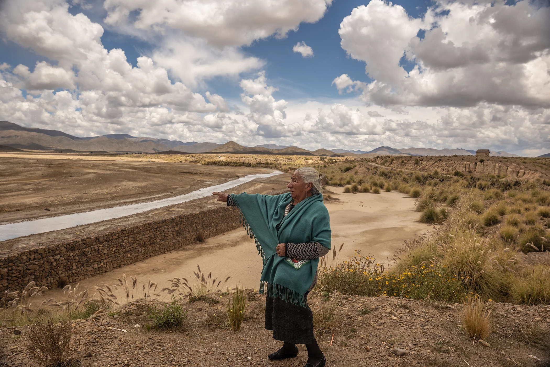 Ms. Margarita Aquino shows the environmental damage caused to the San Juan River located in the community of Sora Sora, municipality of Poopó in Oruro, Bolivia, on Feb 6, 2026. The river is contaminated by toxic waste from mining in the area.