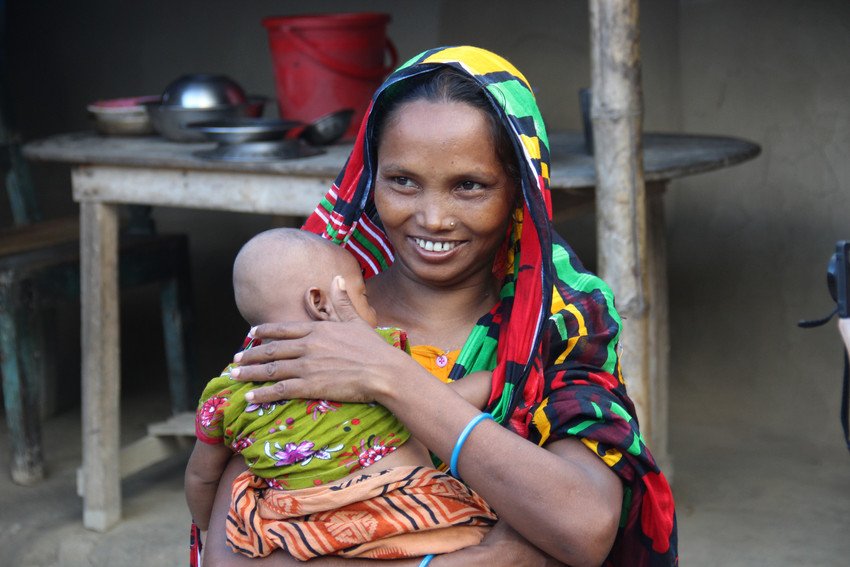 A mother in Bangladesh holds her newborn baby.