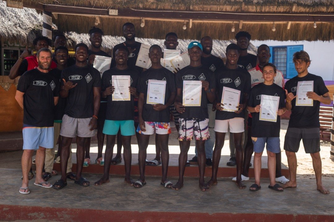 Brett Davies and some members of Mr. Bright's Surf School pose with their certificates