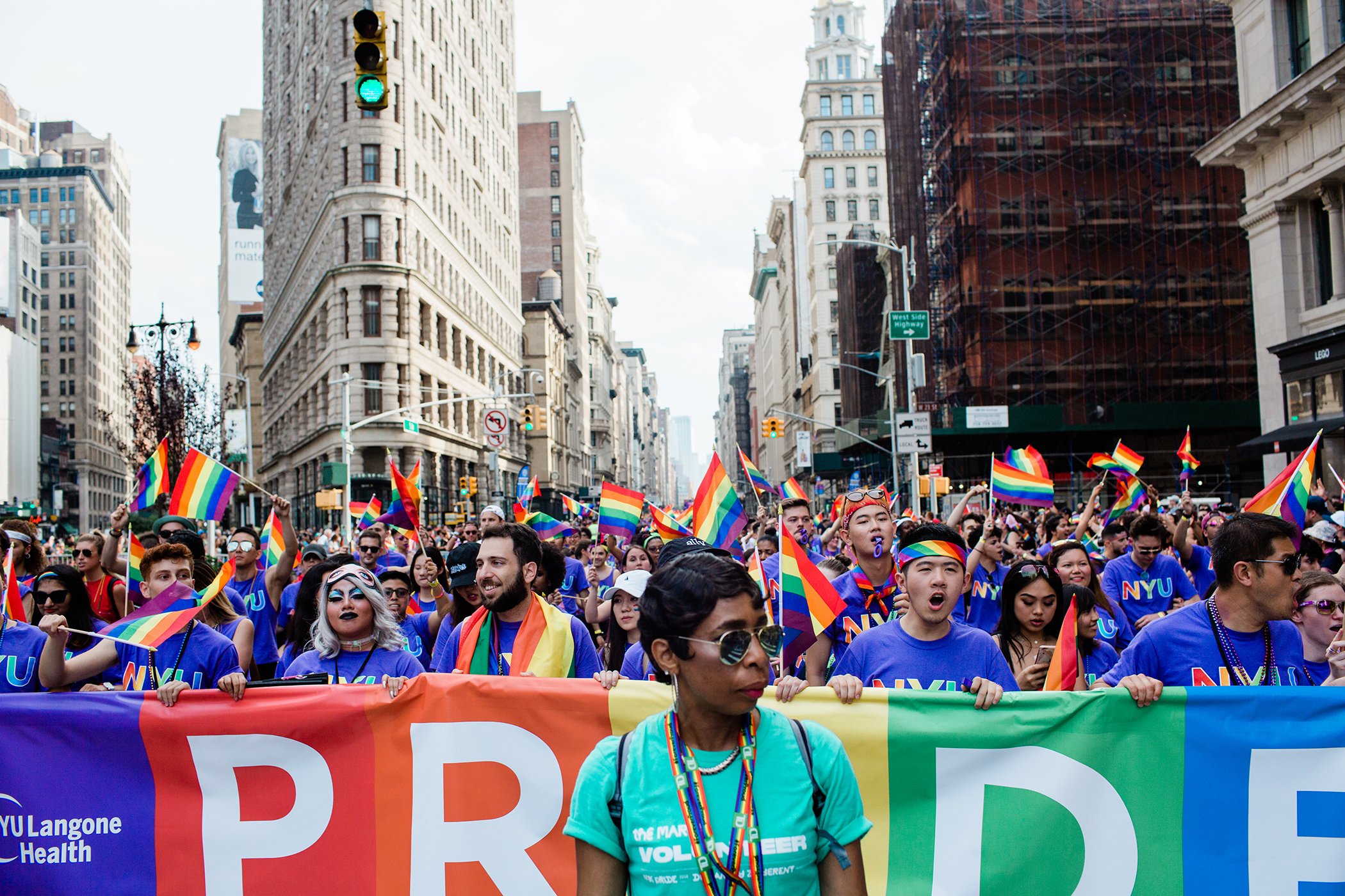 A group of people from NYU march up Fifth Avenue in Manhattan at the 2018 NYC Pride March.
