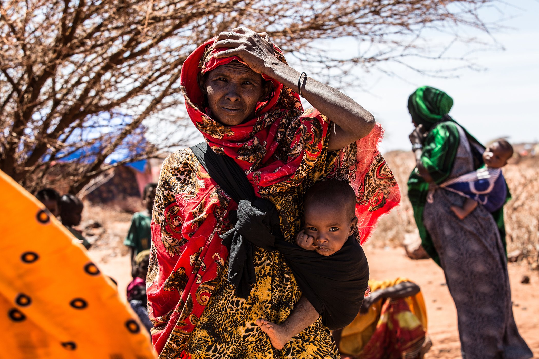 A woman waits to be seen by an MHNT health worker with her 1-year-old daughter. The drought affecting lowland areas across Somalia and Ethiopia is causing severe food and water shortages across Ethiopia’s Somali region.