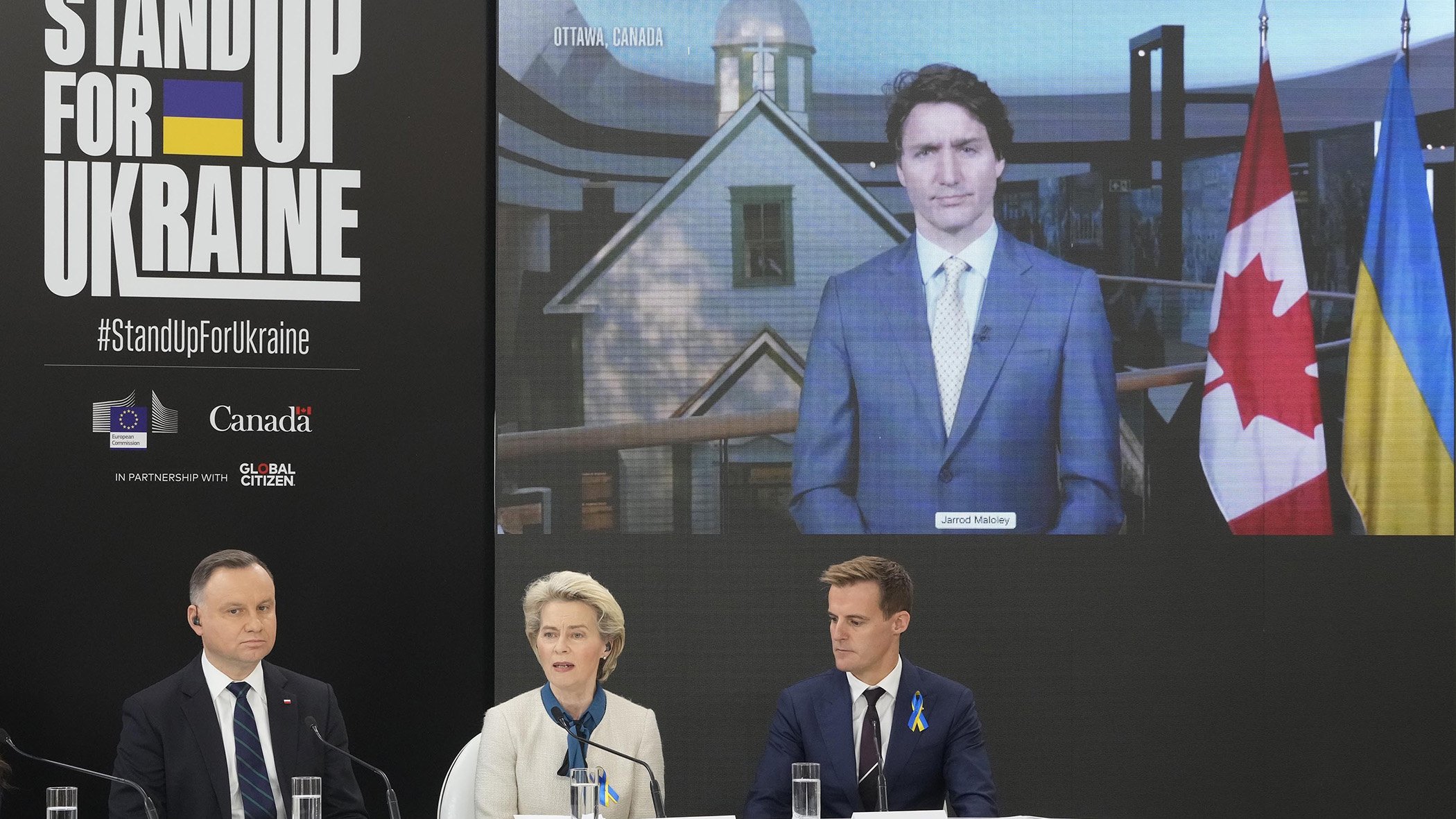 Polish President Andrzej Duda (left), European Commission President Ursula von der Leyen, Global Citizen CEO Hugh Evans, and Canadian Prime Minister Justin Trudeau at the Stand Up for Ukraine pledging event in Warsaw, Poland, on Saturday, April 9, 2022.