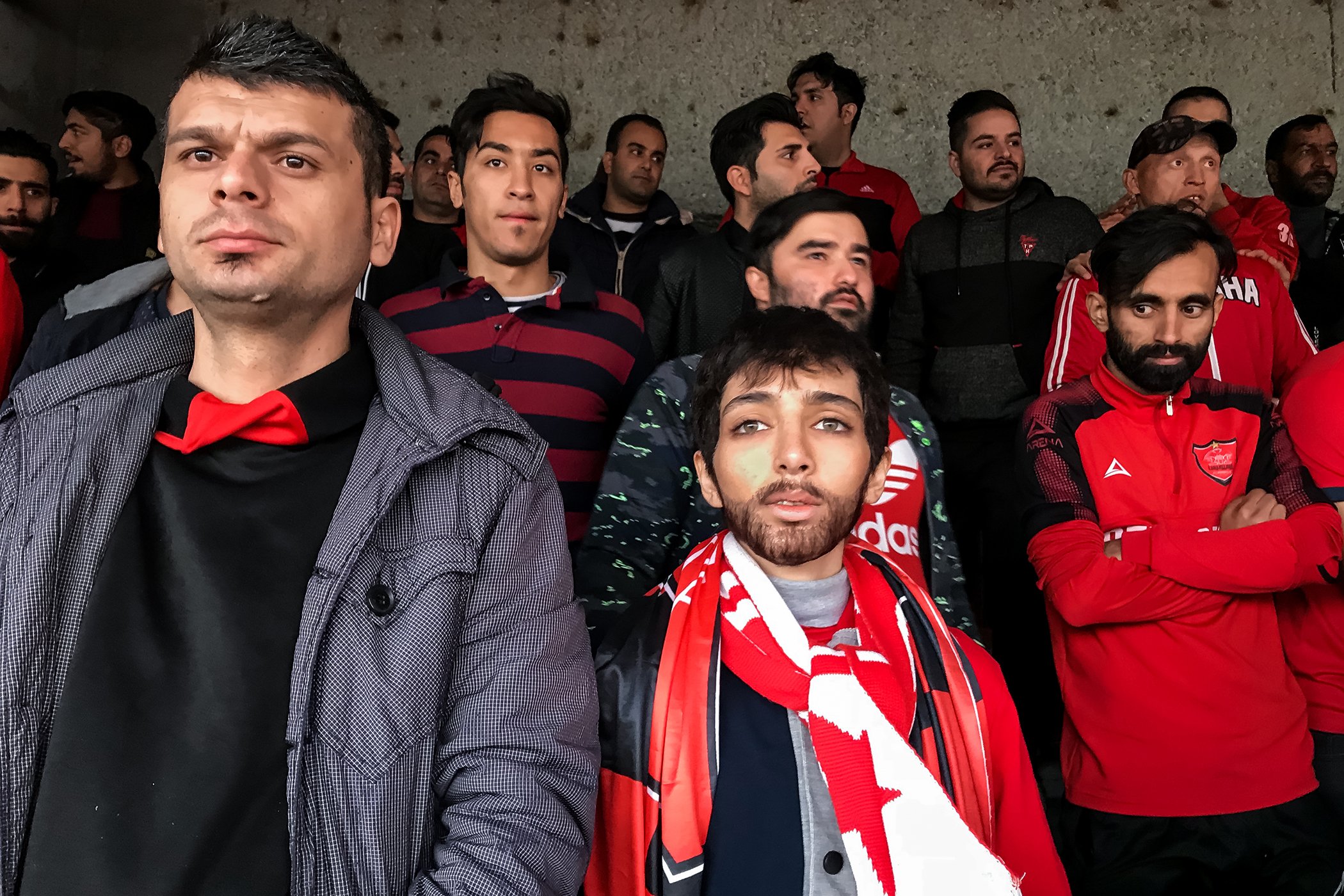 Crying for Freedom: A woman watches the AFC Cup match disguised as a young man. 
In Iran, female fans are banned from entering football stadiums to watch the nation’s most popular sport. Nominated in the Sports Stories category.