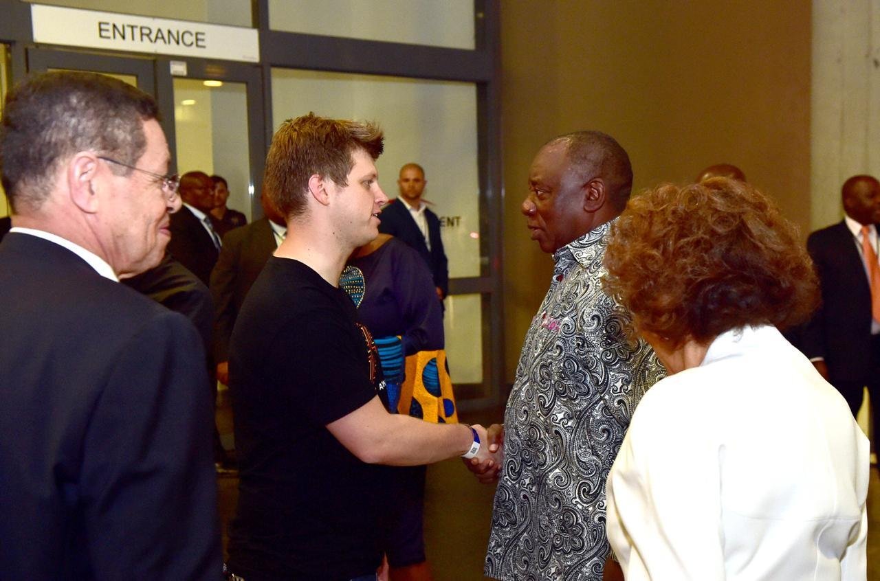 Michael Sheldrick (center) greets South African President Cyril Ramaphosa at Global Citizen Festival: Mandela 100 in December 2018.
