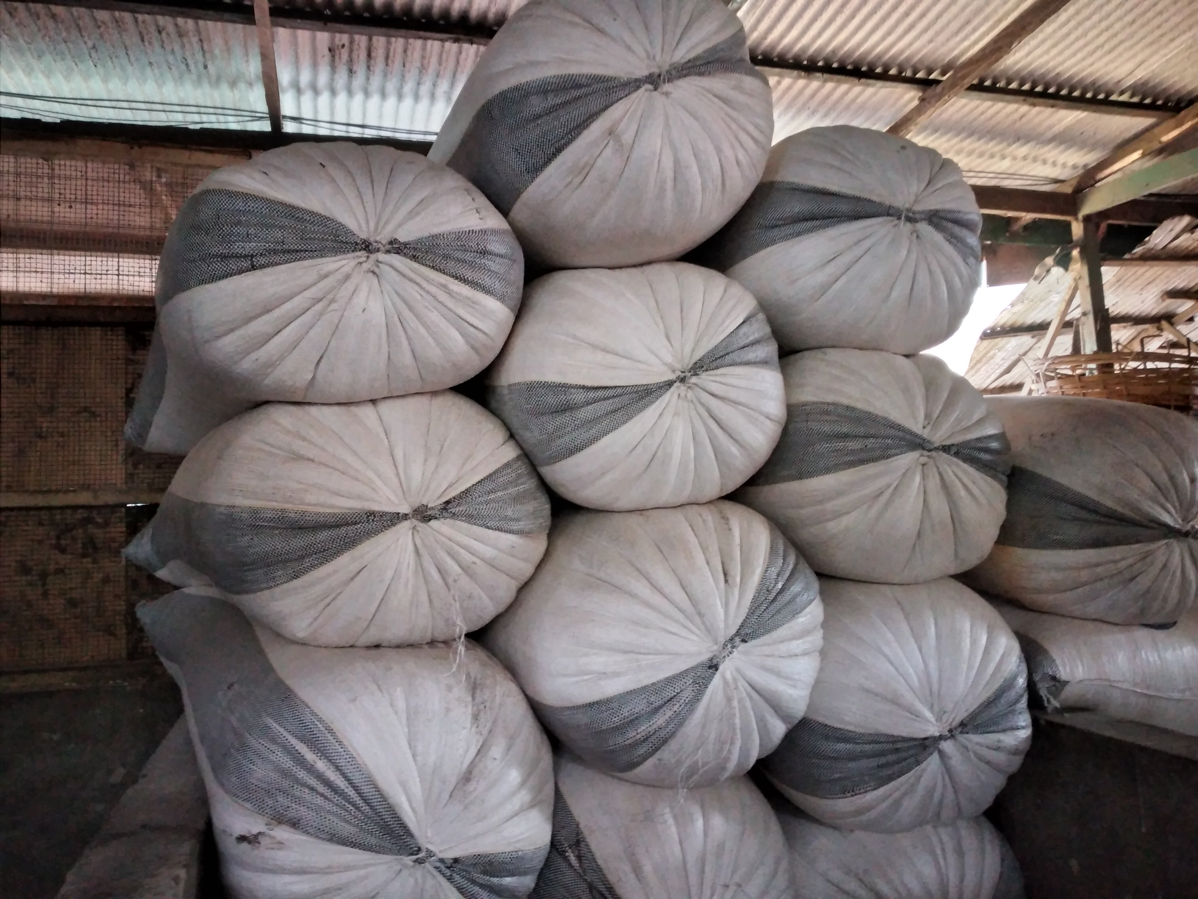 Bags of maize in a stall at Madina market,  Accra