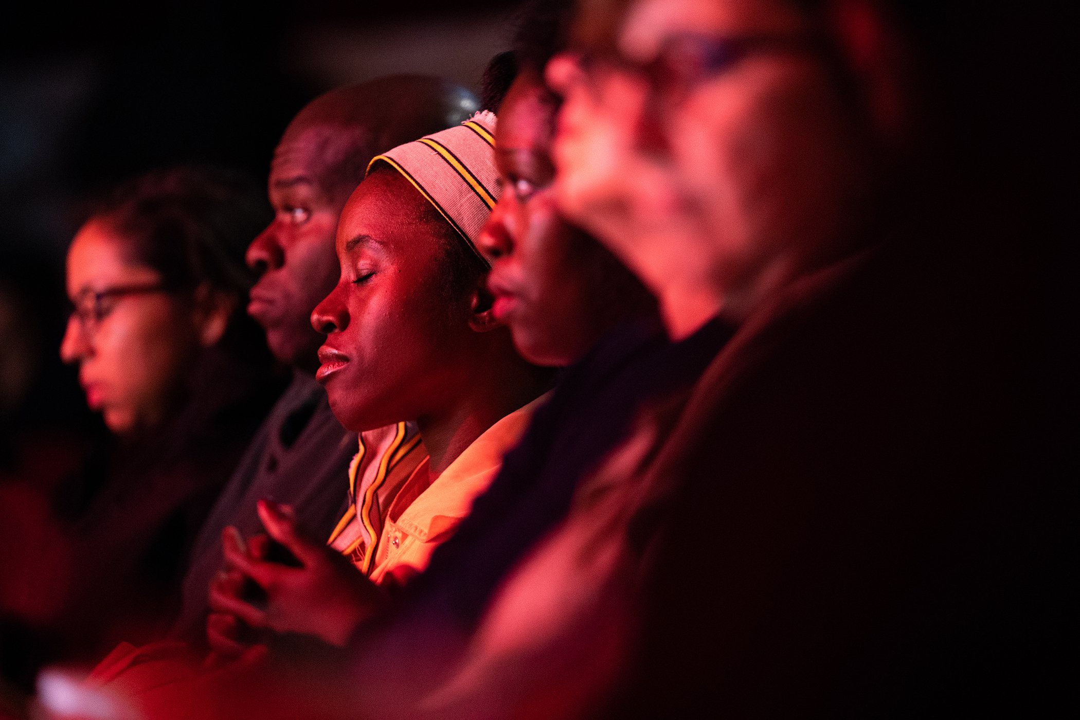 Attendees listen to the speakers onstage during Global Citizen Week: At What Cost? at The Apollo Theater on September 23, 2018 in New York City.