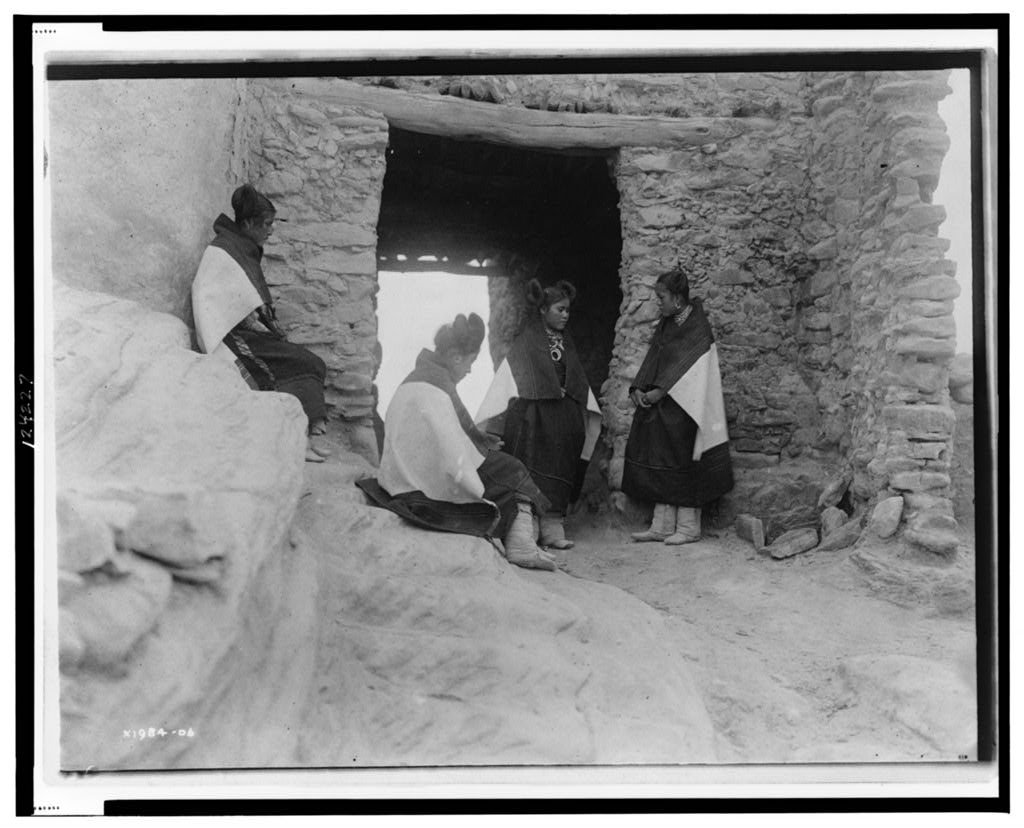 Four young Hopi women are photographed circa 1906. The Hopi are a Native American tribe who primarily live in northeastern Arizona.