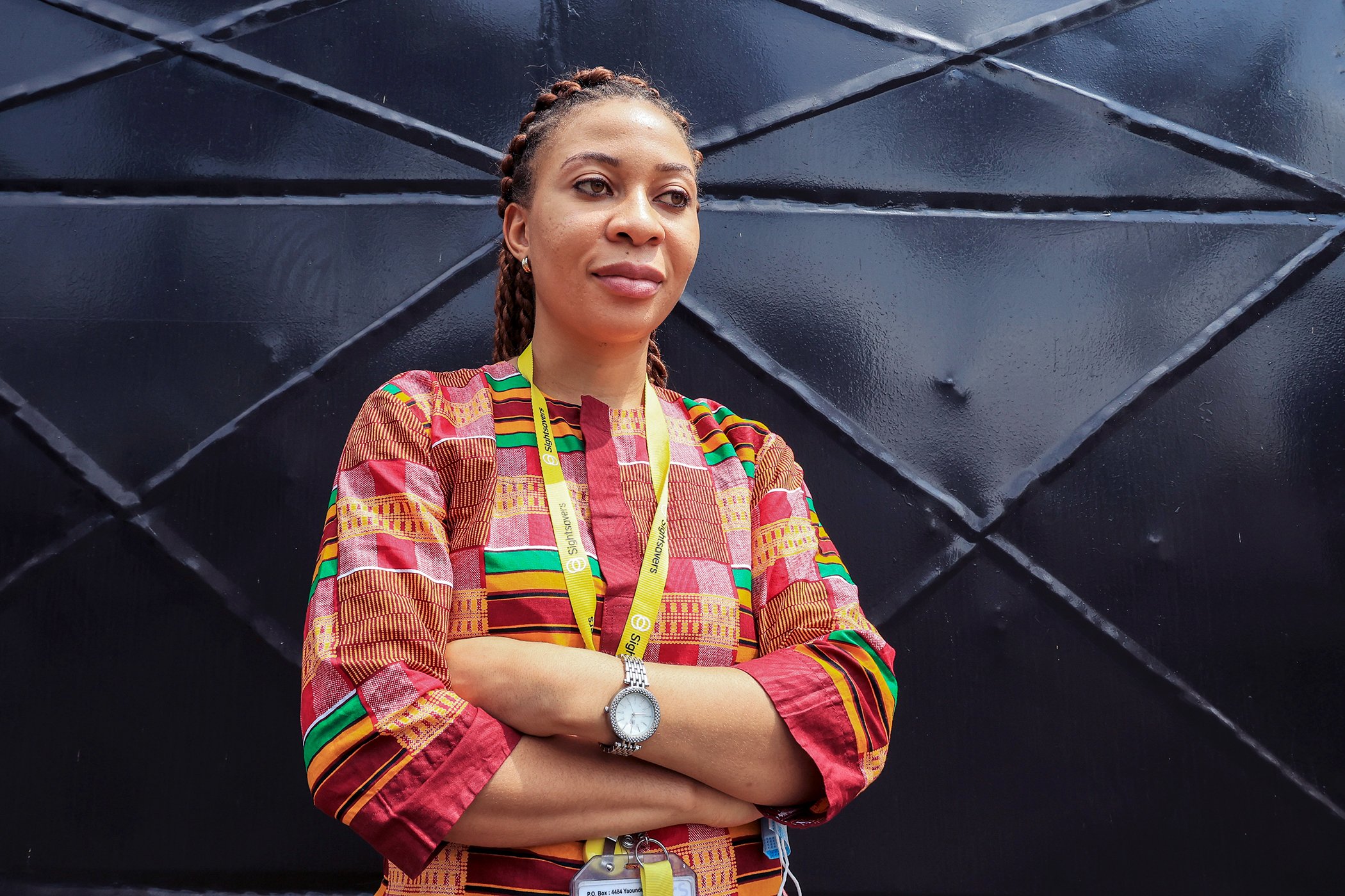 Kareen Atekem, research coordinator at Sightsavers, stands outside the Sightsavers offices in Yaoundé, Cameroon in November 2020.