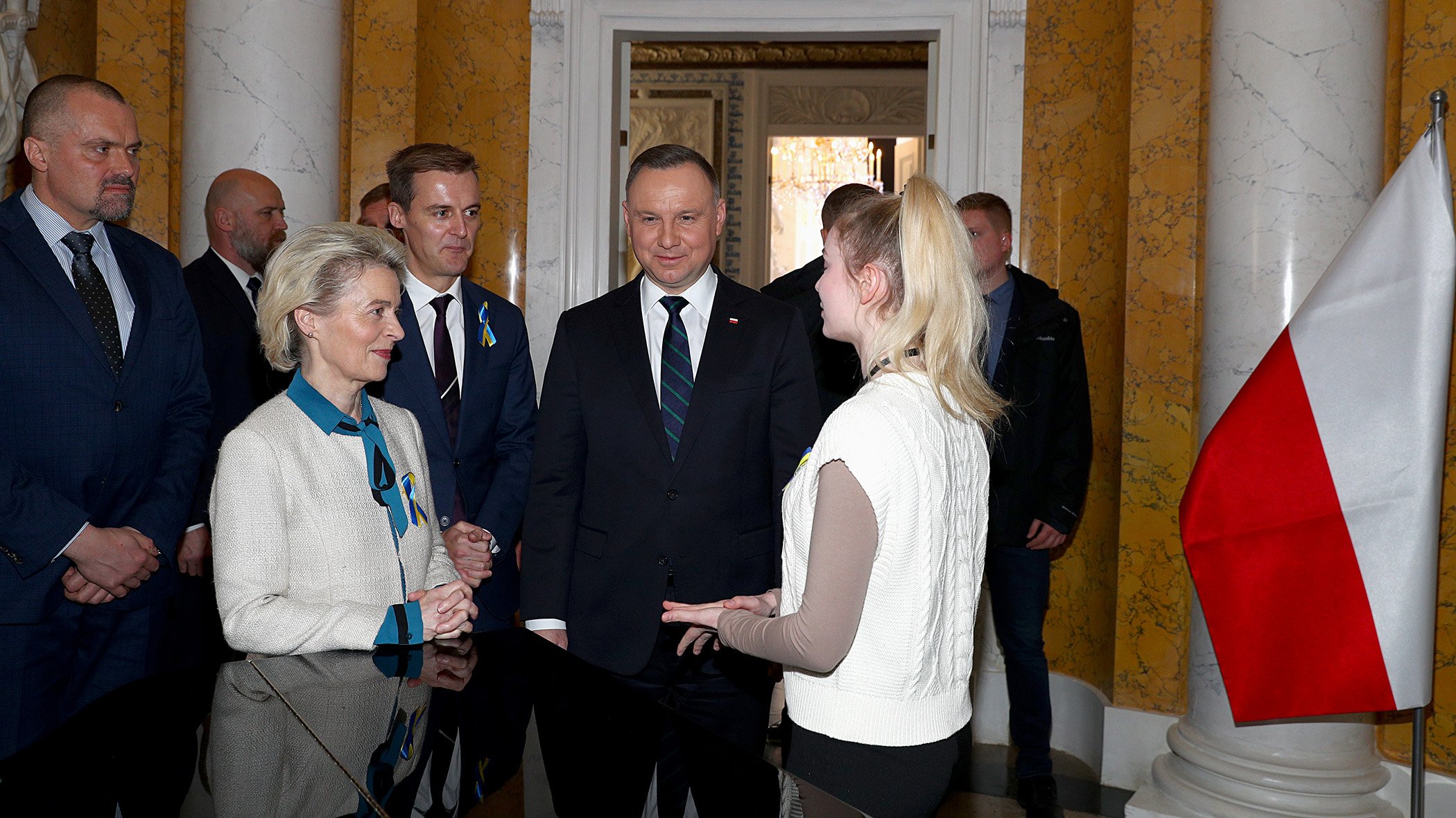 European Commission President Ursula von der Leyen, Global Citizen CEO Hugh Evans, and Polish President Andrzej Duda speak with an activist at the Stand Up for Ukraine pledging event in Warsaw, Poland, on April 9, 2022.