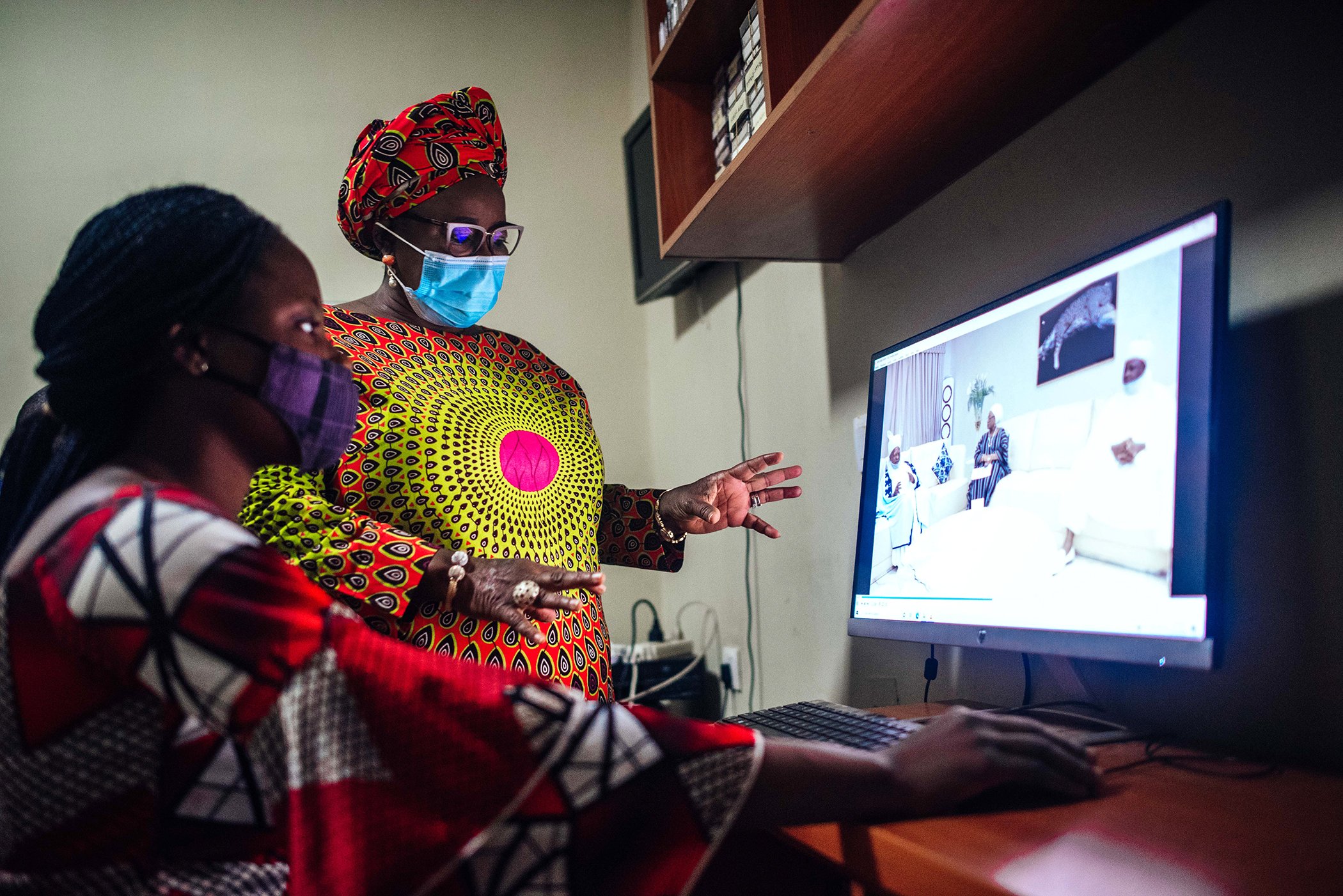 Moji Makanjuola interacts with some of her staff at her studio in Garki, Abuja, Nigeria on Dec. 16, 2020.