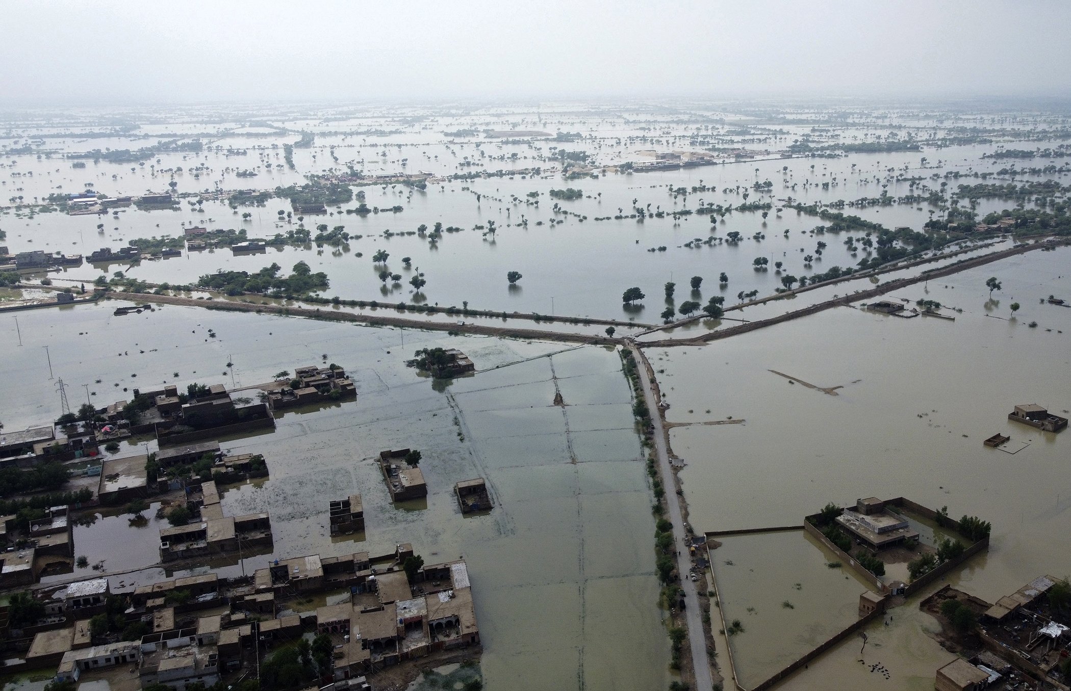 Homes are surrounded by floodwaters in Sohbat Pur city, a district of Pakistan's southwestern Baluchistan province, on Aug. 30, 2022.