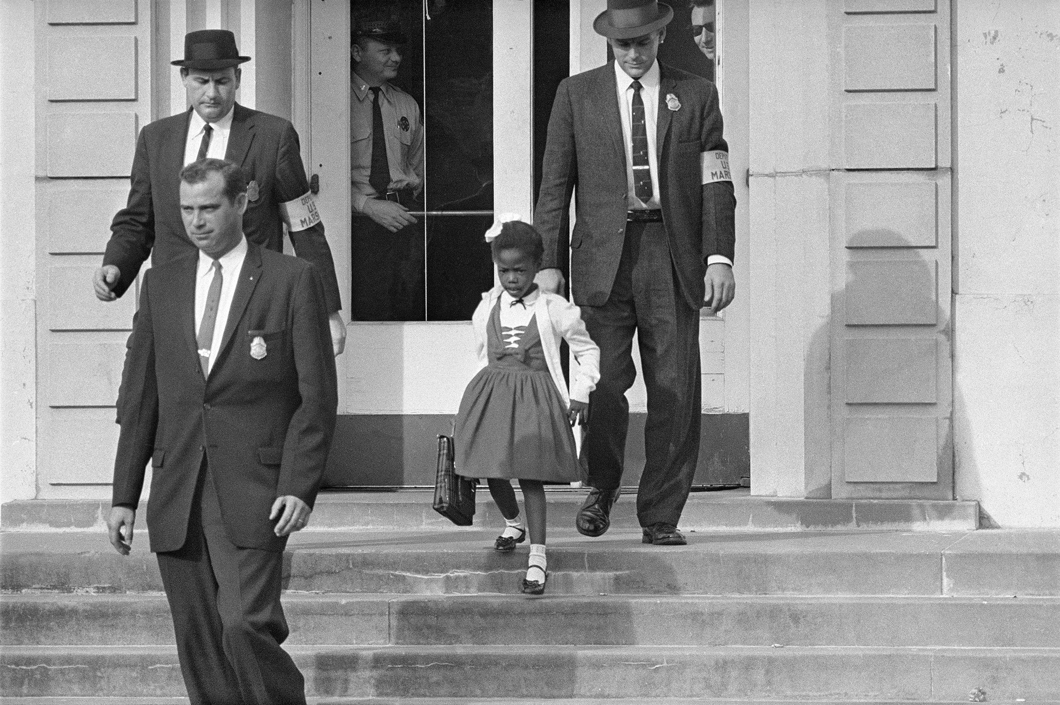 U.S. Deputy Marshals escort 6-year-old Ruby Bridges from William Frantz Elementary School in New Orleans, in this November 1960, file photo.