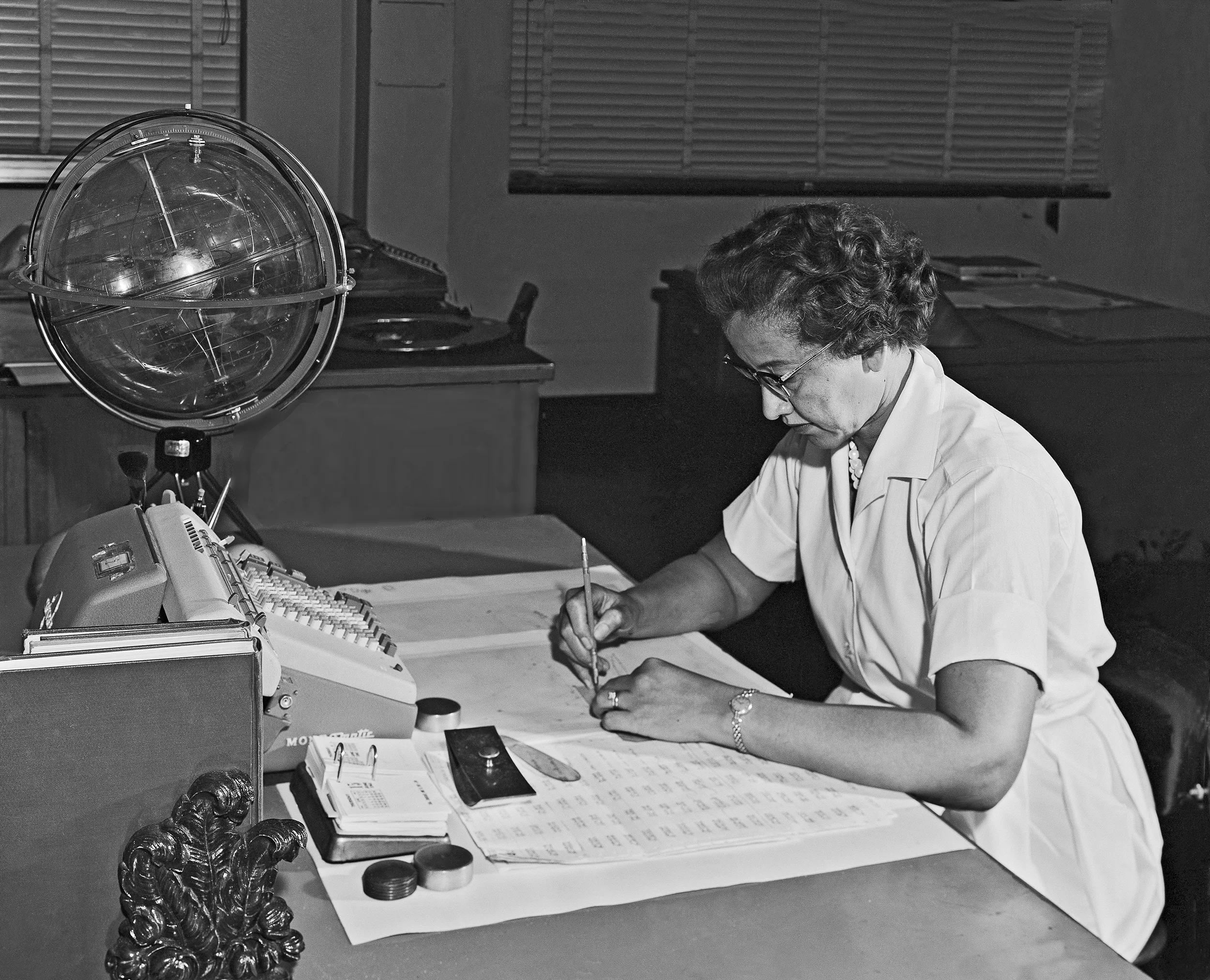 Katherine G. Johnson works at her desk at NASA Langley Research Center.