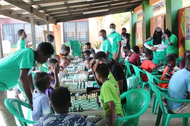 Children learn how to play chess at BASIC International, Chorkor