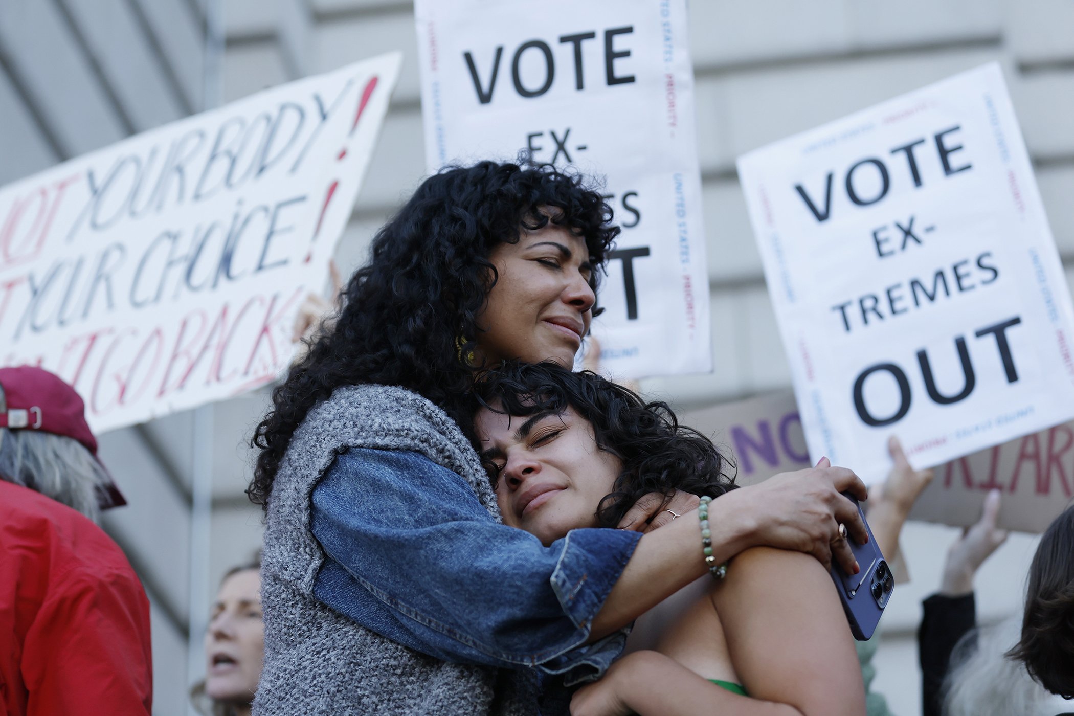 Mitzi Rivas, left, hugs her daughter Maya Iribarren during an abortion-rights protest at City Hall in San Francisco, following the Supreme Court's decision to overturn Roe v. Wade, June 24, 2022.