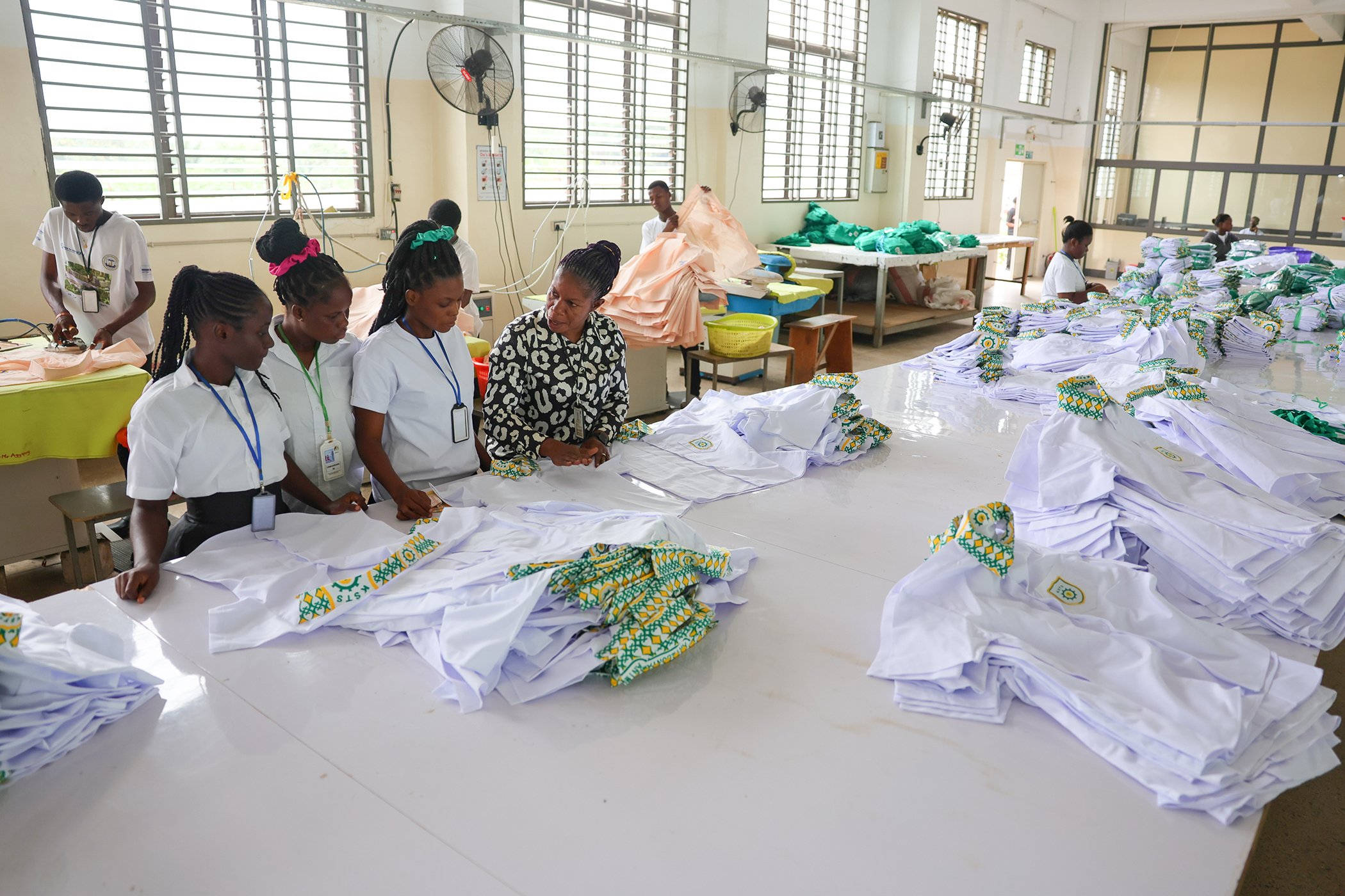 Senior staff member Anita Wiafe supervises and guides workers at the UNI Jay factory in Kumasi, Ghana, on August 4, 2025.