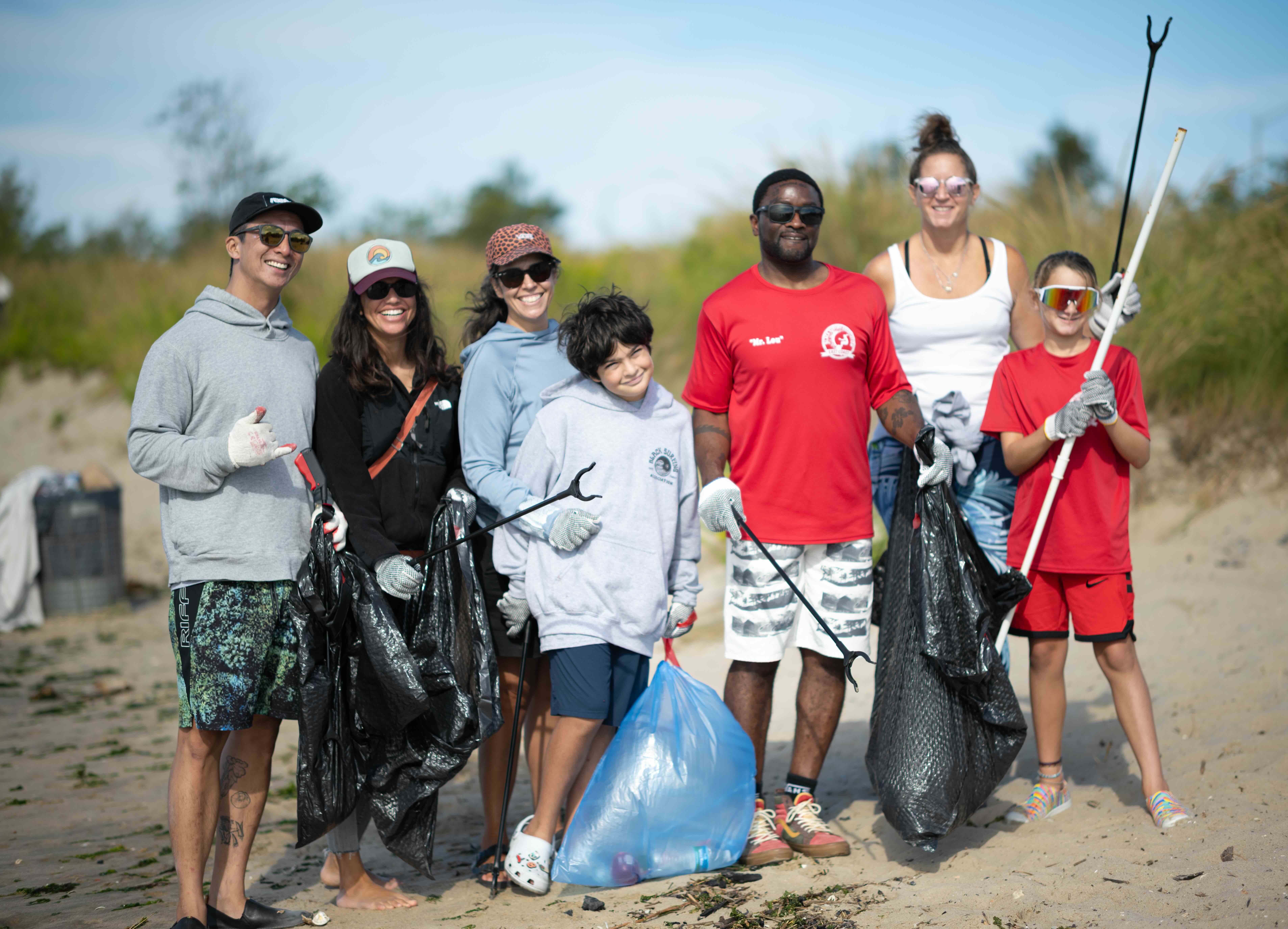 Black Surfing Association volunteers and friends attend Plumb Beach cleanup. Image: Zoë Arnitois