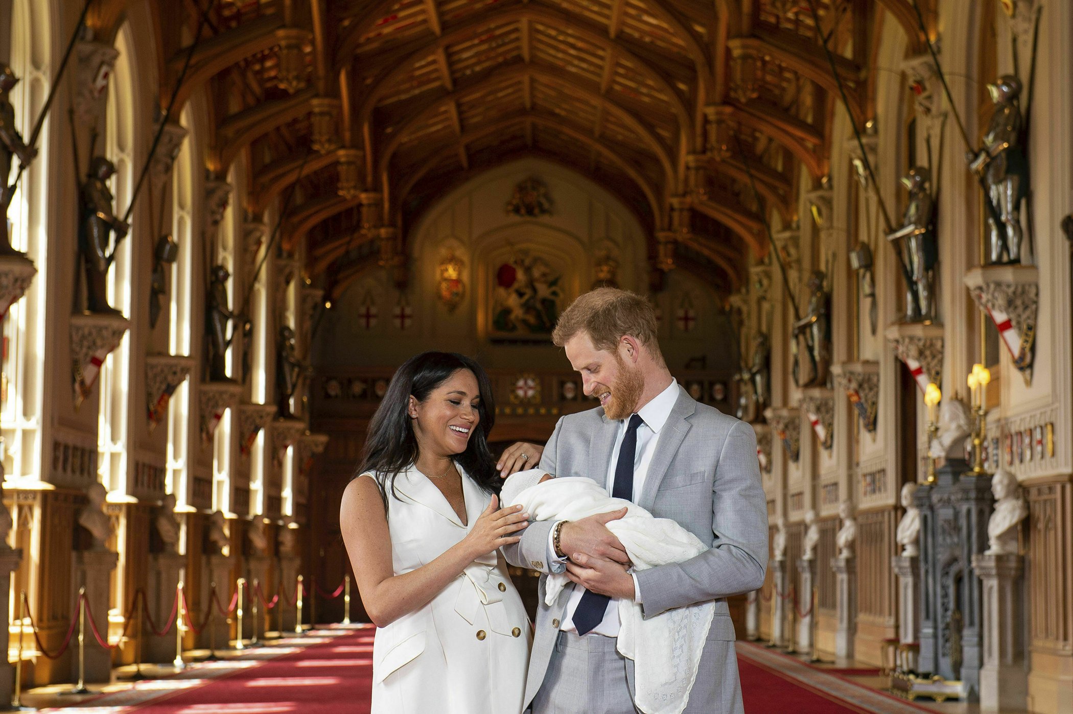 Britain's Prince Harry and Meghan, Duchess of Sussex, during a photocall with their newborn son, in St George's Hall at Windsor Castle, Windsor, south England May 8, 2019.