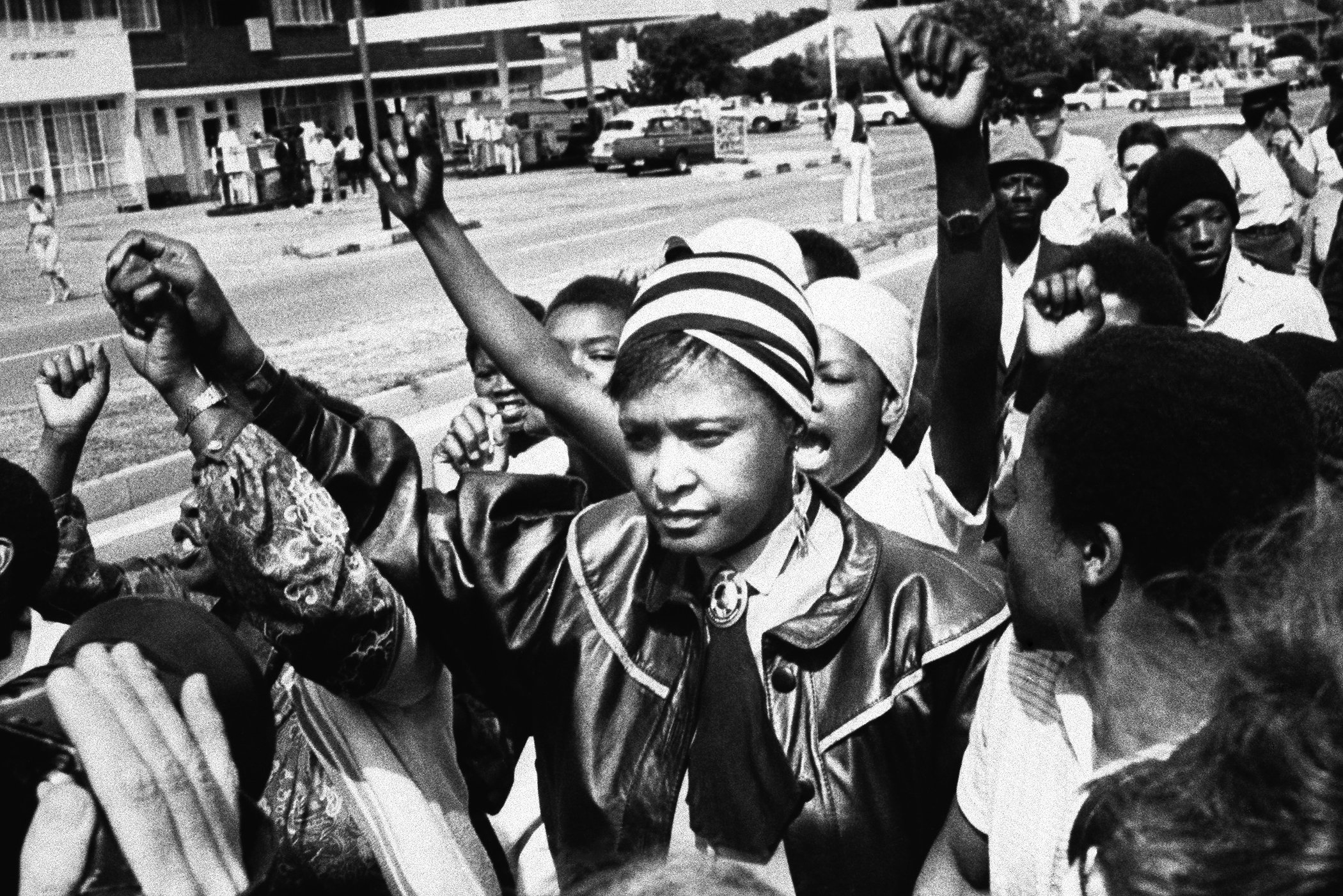 Black activist Winnie Mandela is cheered by supporters after appearing in the Krugersdorp Magistrate's court, West of Johannesburg on Jan. 22, 1986 in Krugersdorp, South Africa.