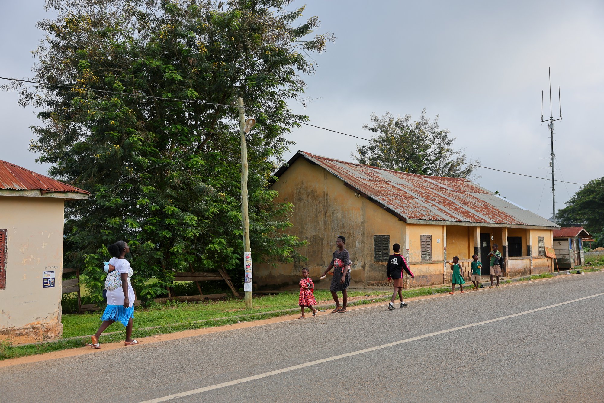 Abigail Debrah, 24, on her way to the Kotokuom CHPS Compound in the Ayemansa District, Eastern Region, Ghana, on July 16, 2025.