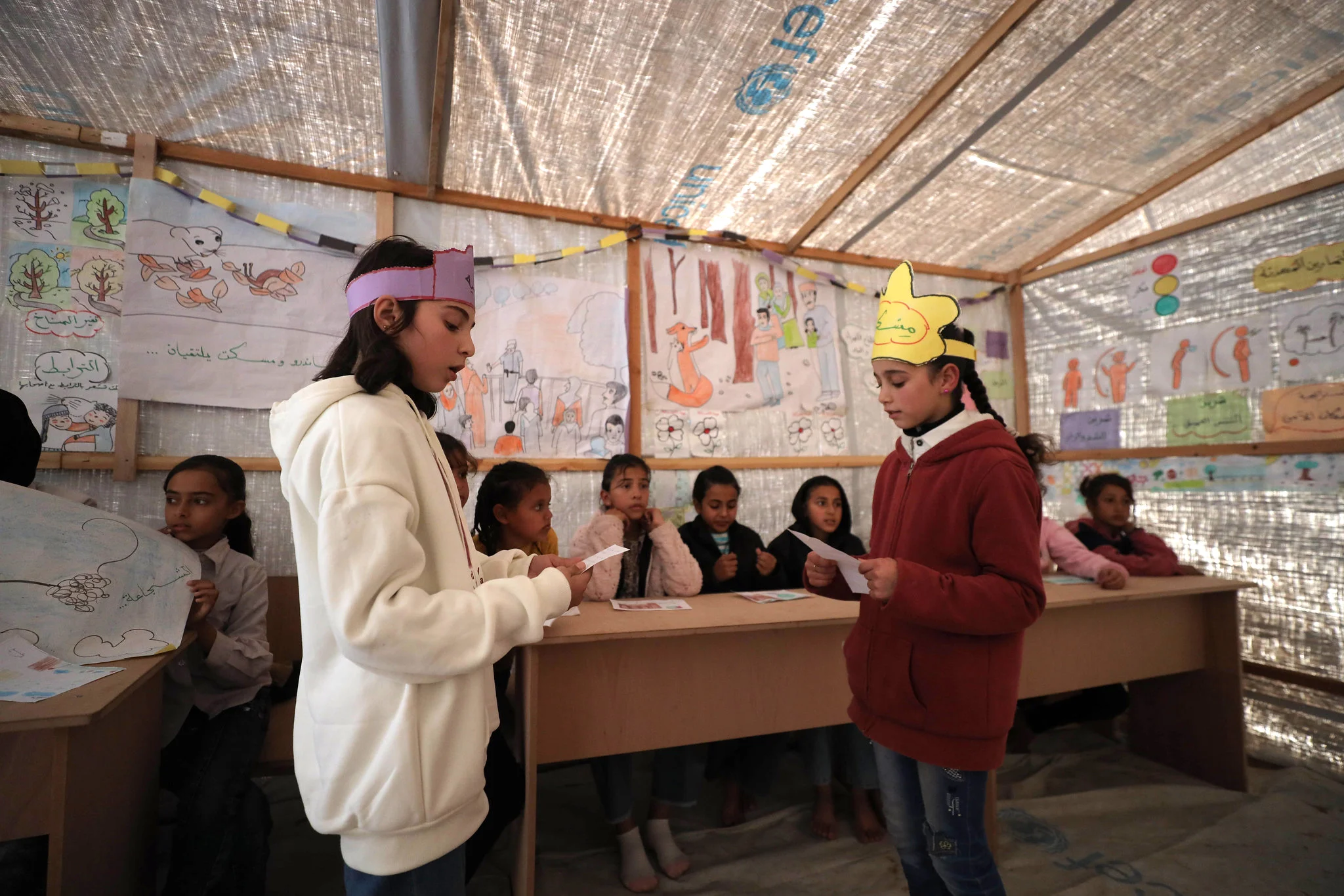 Children engaging in a learning activity at a temporary educational space in Gaza, part of NRC's Better Learning Programme.