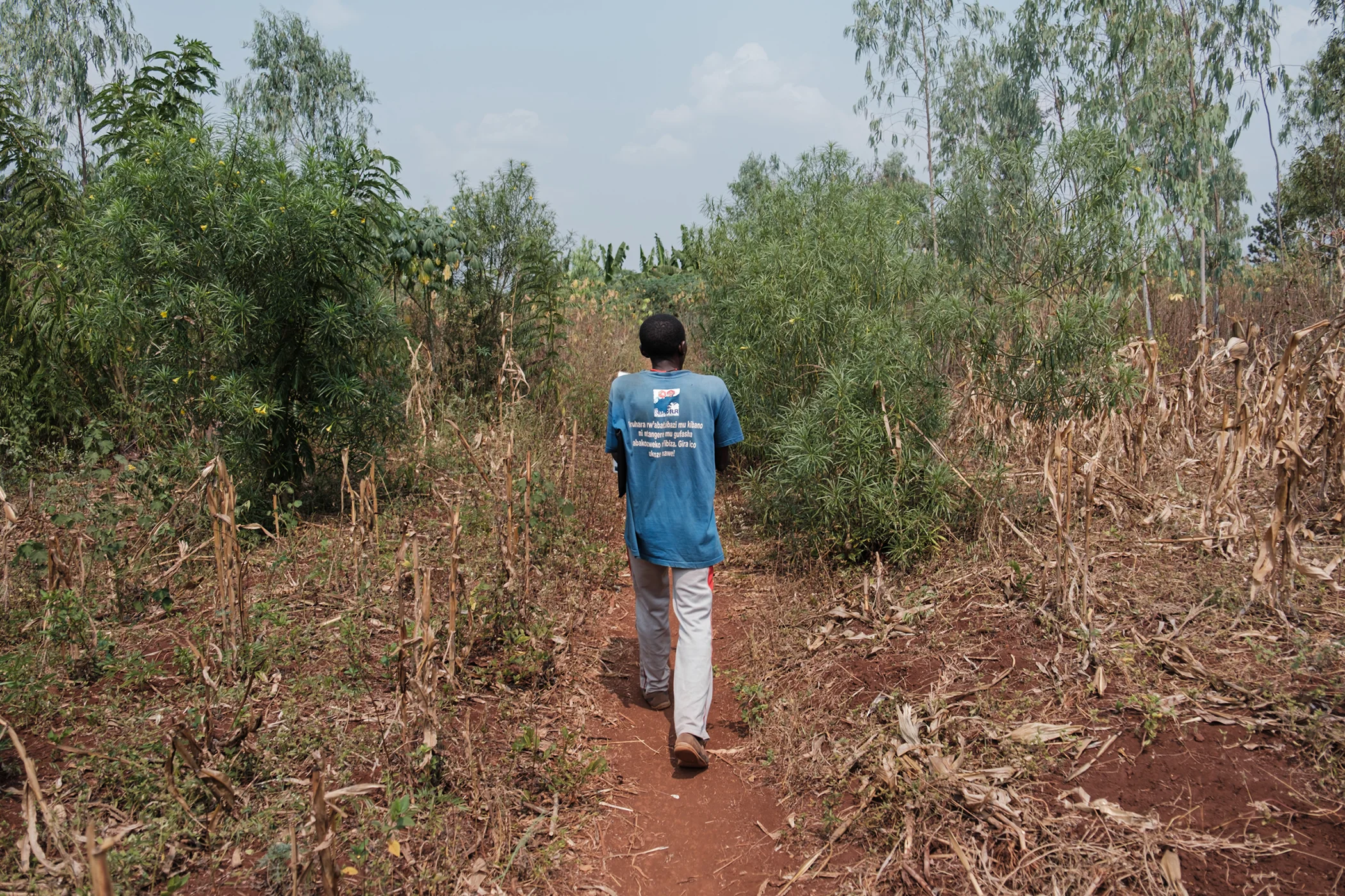 Pascale Kayobera is pictured in the field during a site visit in July 2025.. “This work is important for me, the community and the entire country,” Kayobera says.