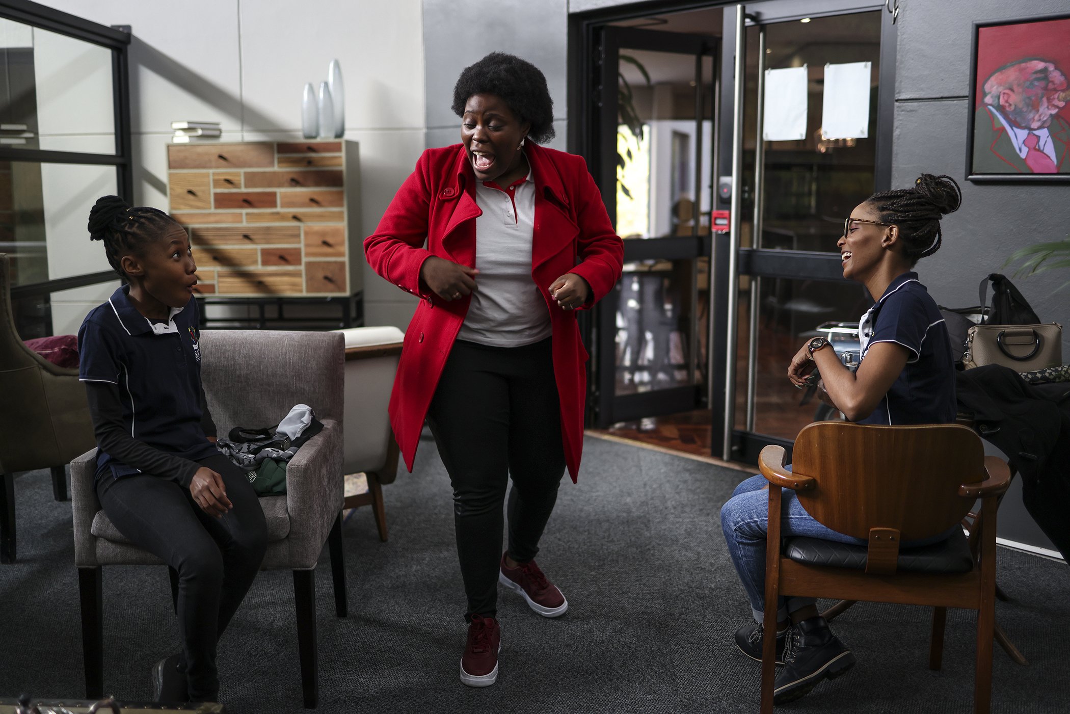 Candice Chirwa (R) talks with Qrate facilitators Felicia Thobejane, 25, and Trish Cele, 24, on May 8, 2021, in Johannesburg, South Africa. Chirwa started Qrate to create a space for fun, dynamic, and comprehensive menstrual education workshops.