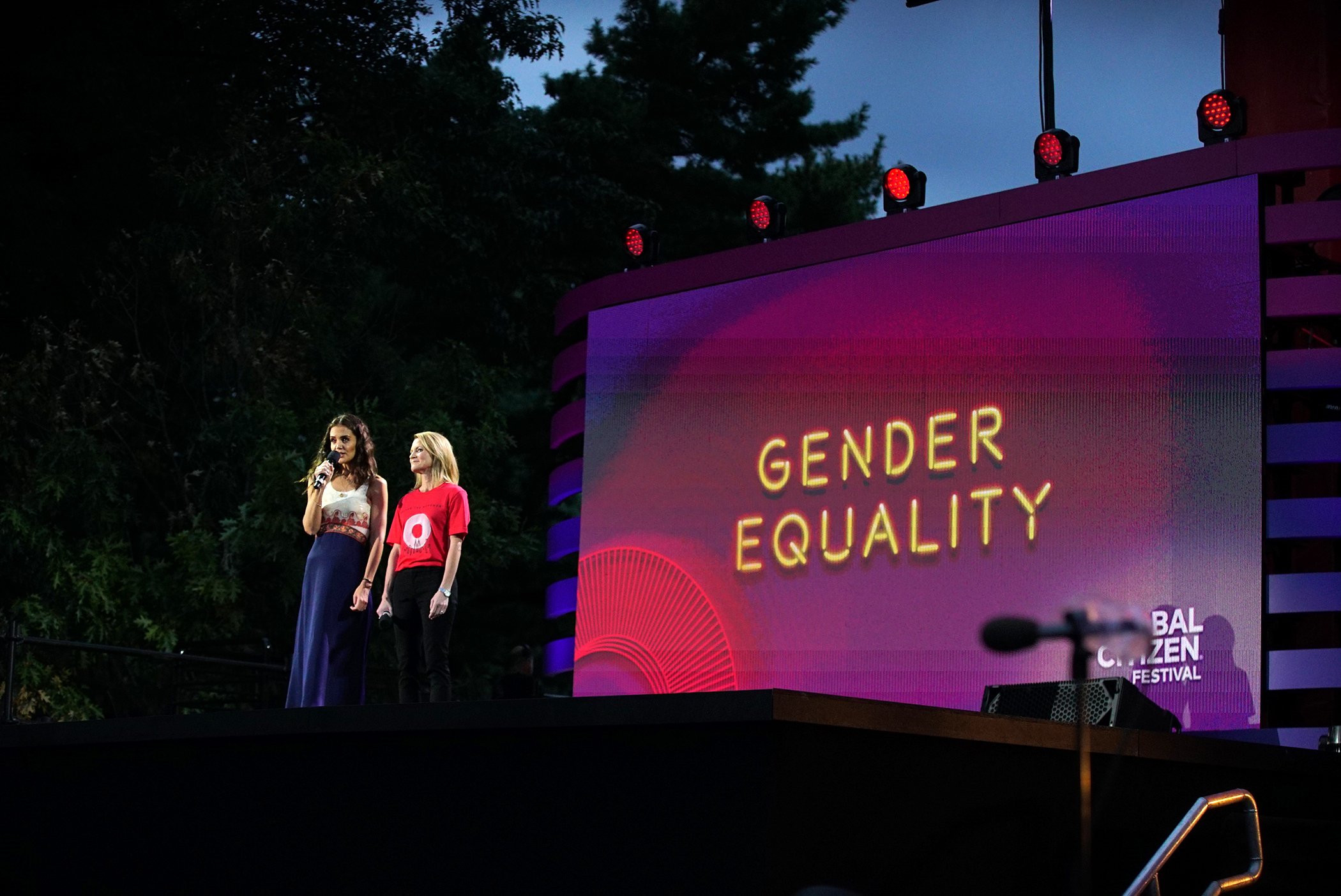 Katie Holmes and Proctor & Gamble President Feminine Care Jennifer Davis speak onstage during the 2019 Global Citizen Festival on Sept. 28, 2019 in New York City.