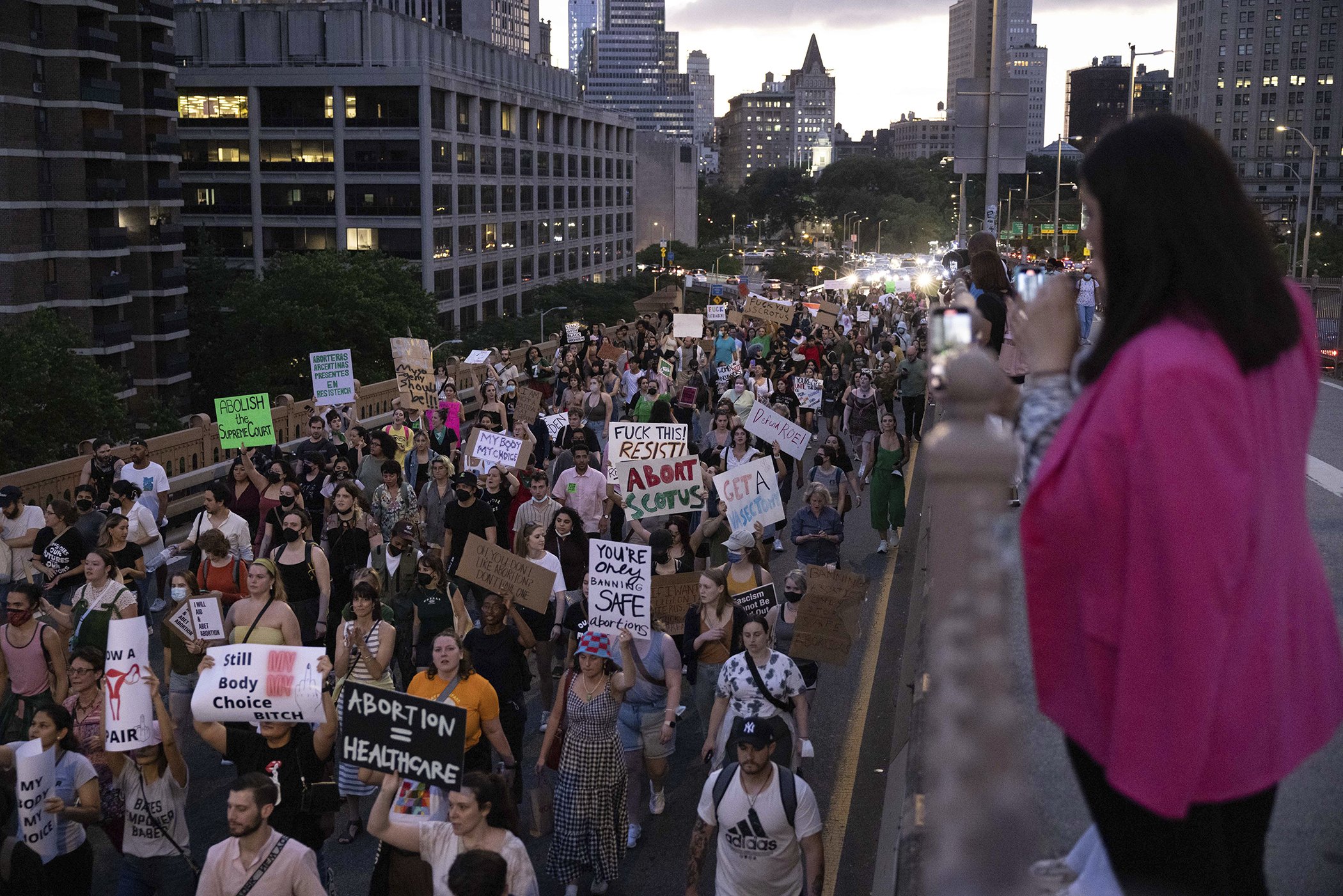 Abortion-rights activists march on the Brooklyn Bridge during a protest following Supreme Court's decision to overturn Roe v. Wade, June 24, 2022, in New York.