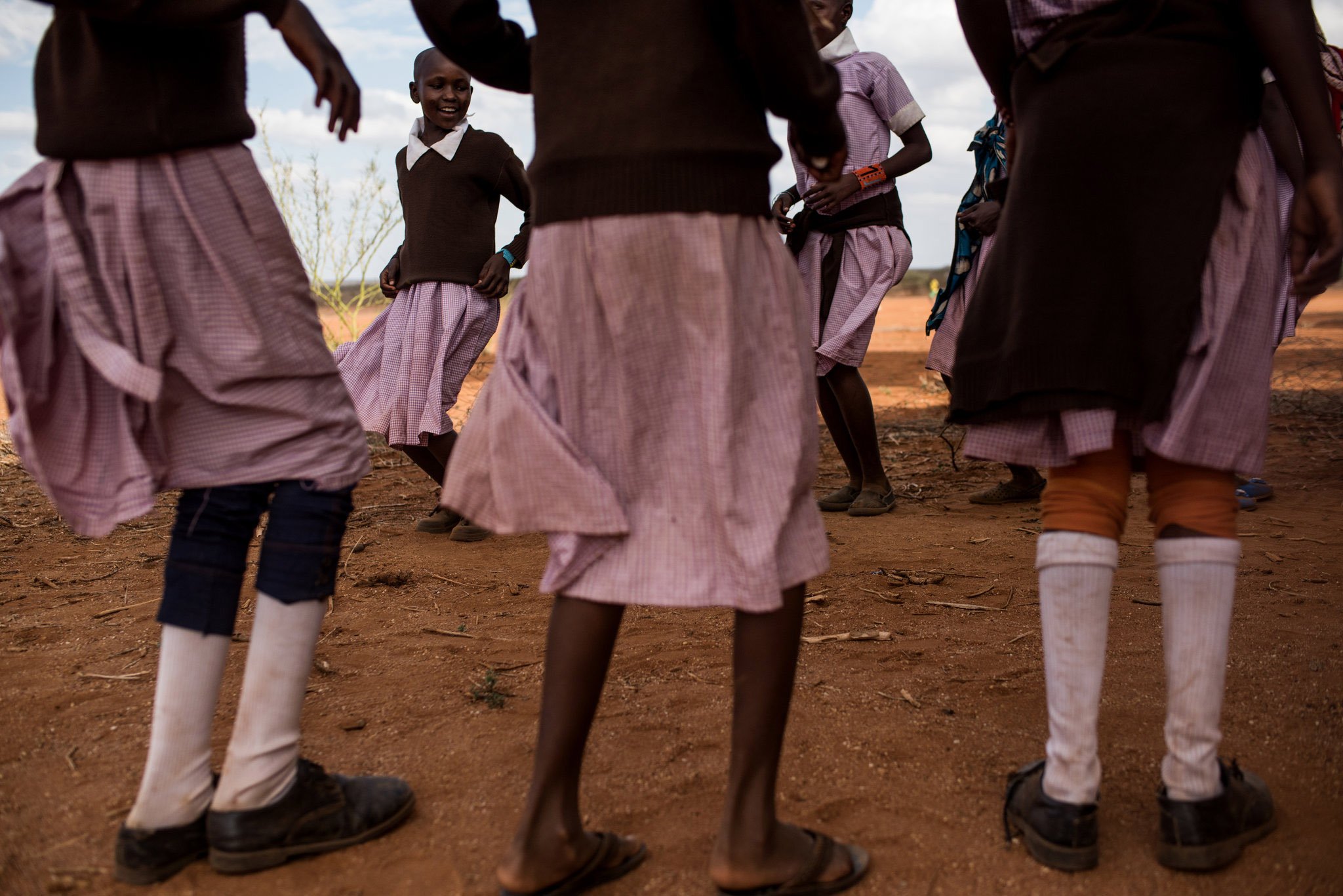 In the Maasai village of Lenkisem, girls between 9-16 participate in a two-day ceremony that brings girls from surrounding villages to one school. They bonded while being educated on their basic rights and why female genital mutilation (FGM) is unhealthy.