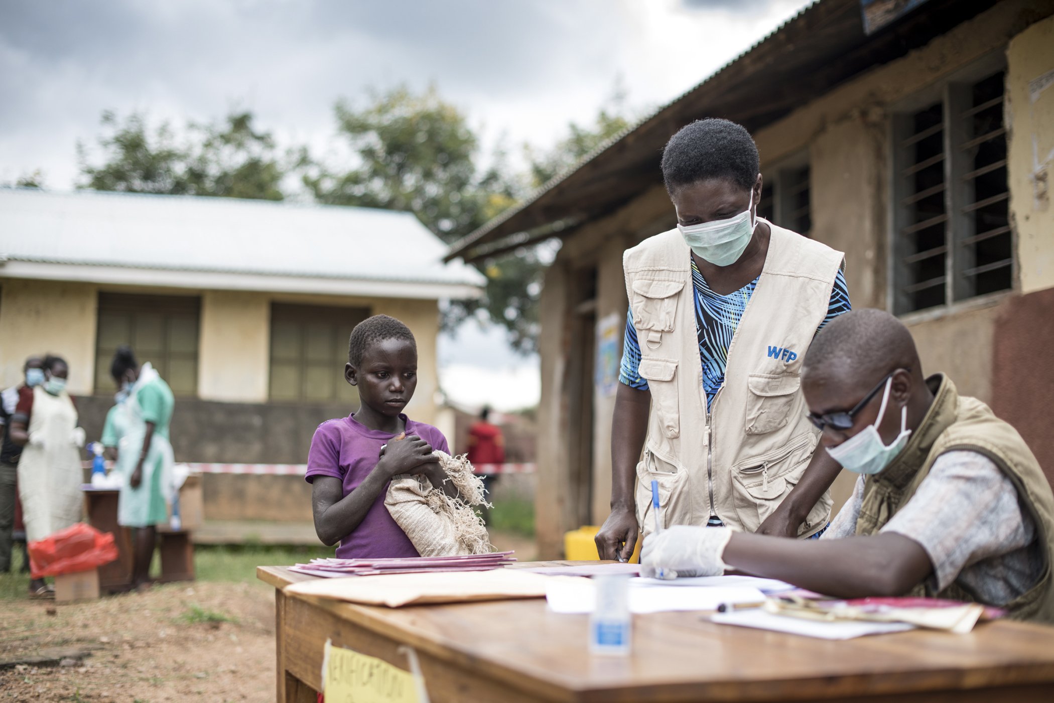 Take-home ration distribution at Kakamar Primary School, July 2020. The Government of Uganda and the WFP are distributing food rations to children in the Karamoja region in Uganda to support home-learning while schools remain closed due to the COVID-19.