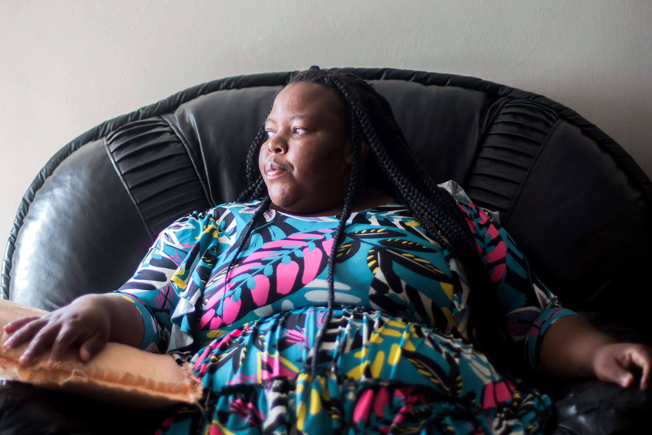 Noluthando Mhlongo rests at home for a moment before heading to work at the Phoenix Community Health Centre in Phoenix, north of Durban, on March 14, 2022.