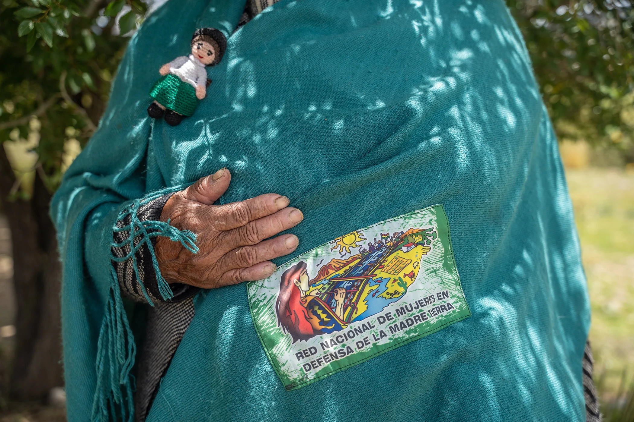 Margarita Aquino shows a badge she wears as Coordinator of RENAMAT (National Network of Women in Defense of Mother Earth), an organization of Andean and Indigenous women dedicated to the defense of Mother Earth. Pictured in Oruro, Bolivia on Feb. 6 2026.