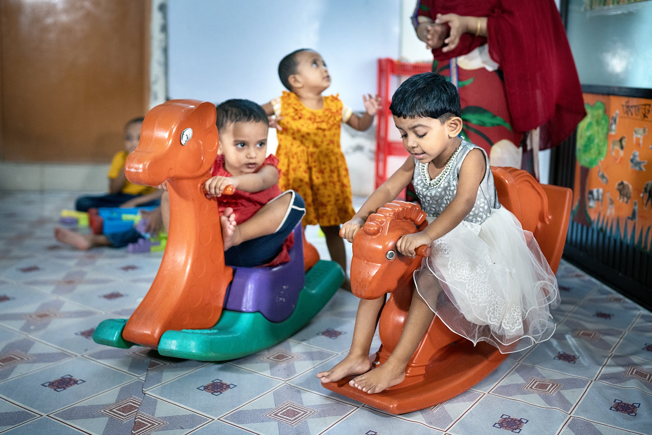 Nusrat Jahan plays with other children at the child care center of Evince Garments Limited in Dhaka, Bangladesh.