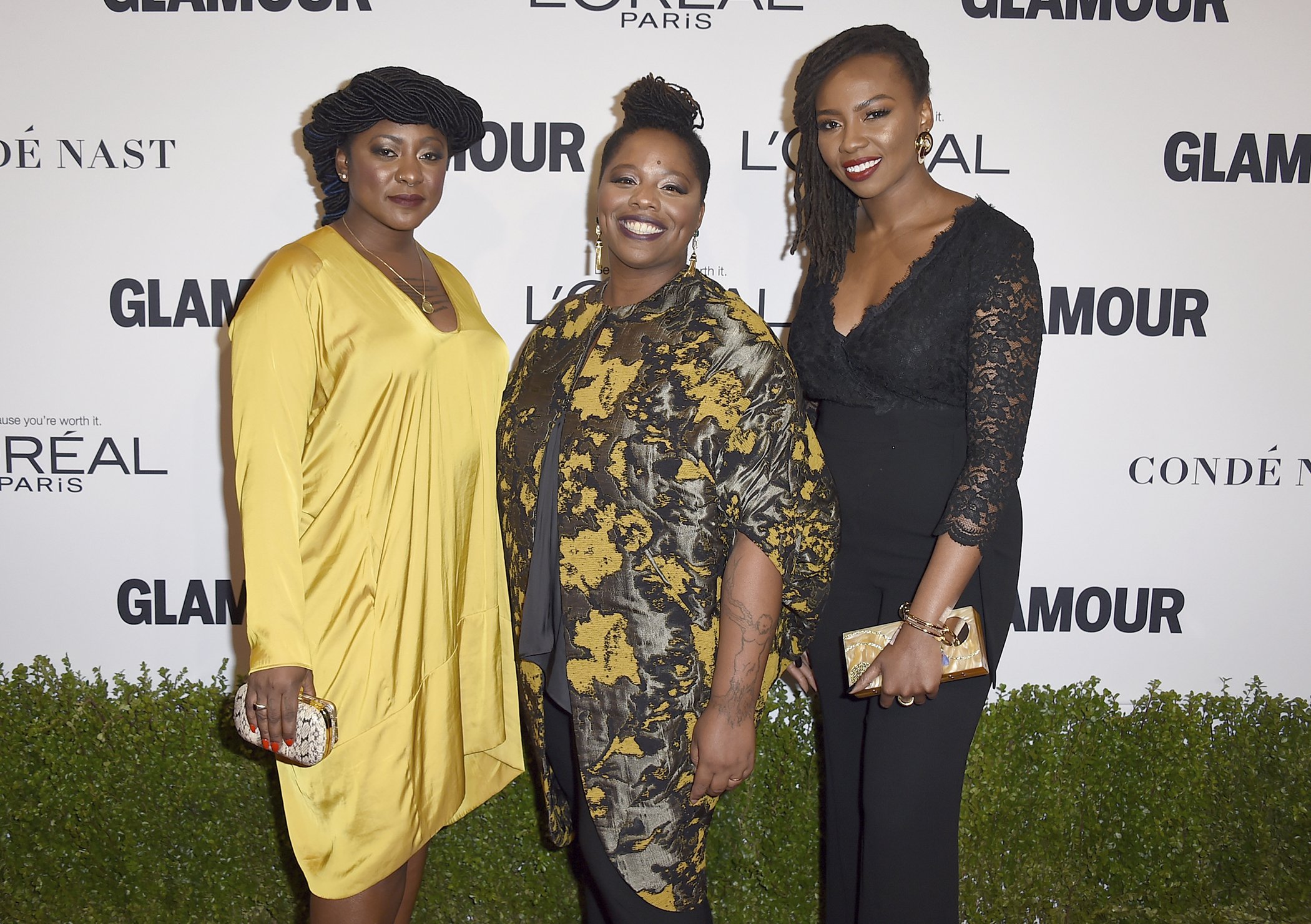 Alicia Garza, from left, Patrisse Cullors and Opal Tometi, co-founders of the Black Lives Matter movement, arrive at the Glamour Women of the Year Awards on Monday, Nov. 14, 2016, in Los Angeles.