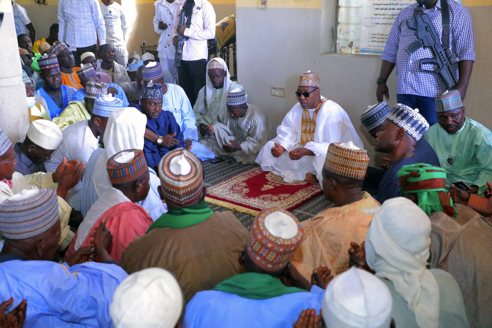 Babagana Umara Zulum, center, governor of Borno State, prays during a funeral for those killed by suspected Boko Haram militants in Zaabarmar, Nigeria, Nov. 29, 2020.