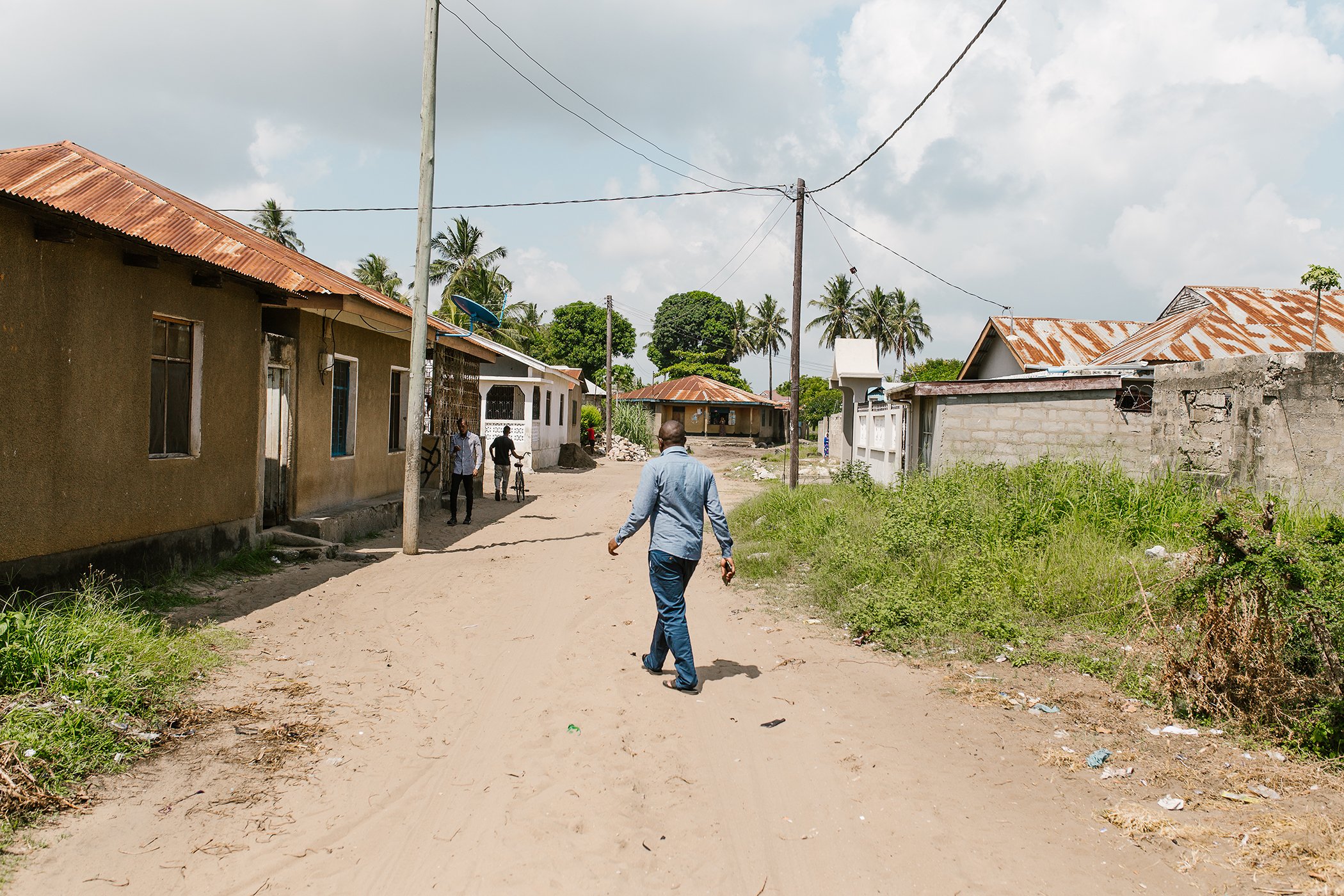 Joachim Mabula walks in Tanga, the coastal city where he now lives, on Dec. 5, 2020. In 2017, while working as a general practitioner at a public health centre, Mabula founded Tiba Faster, an online platform providing simple health information in Swhaili.