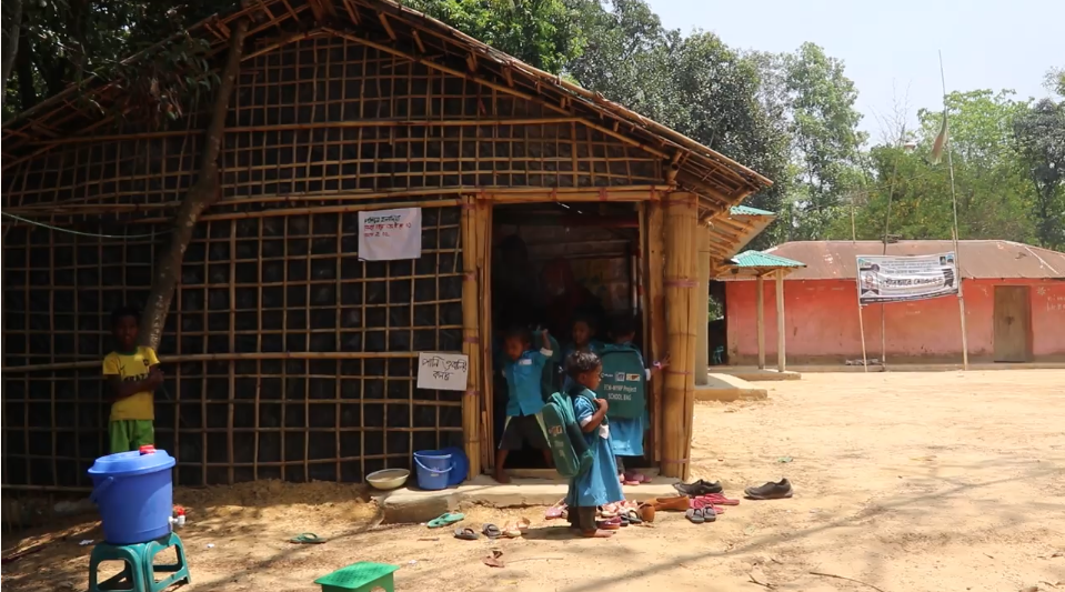 Students finish school for the day and wait for parents to pick them up. When humanitarian crises arise, like armed conflict or natural disasters, children are particularly vulnerable to threats.