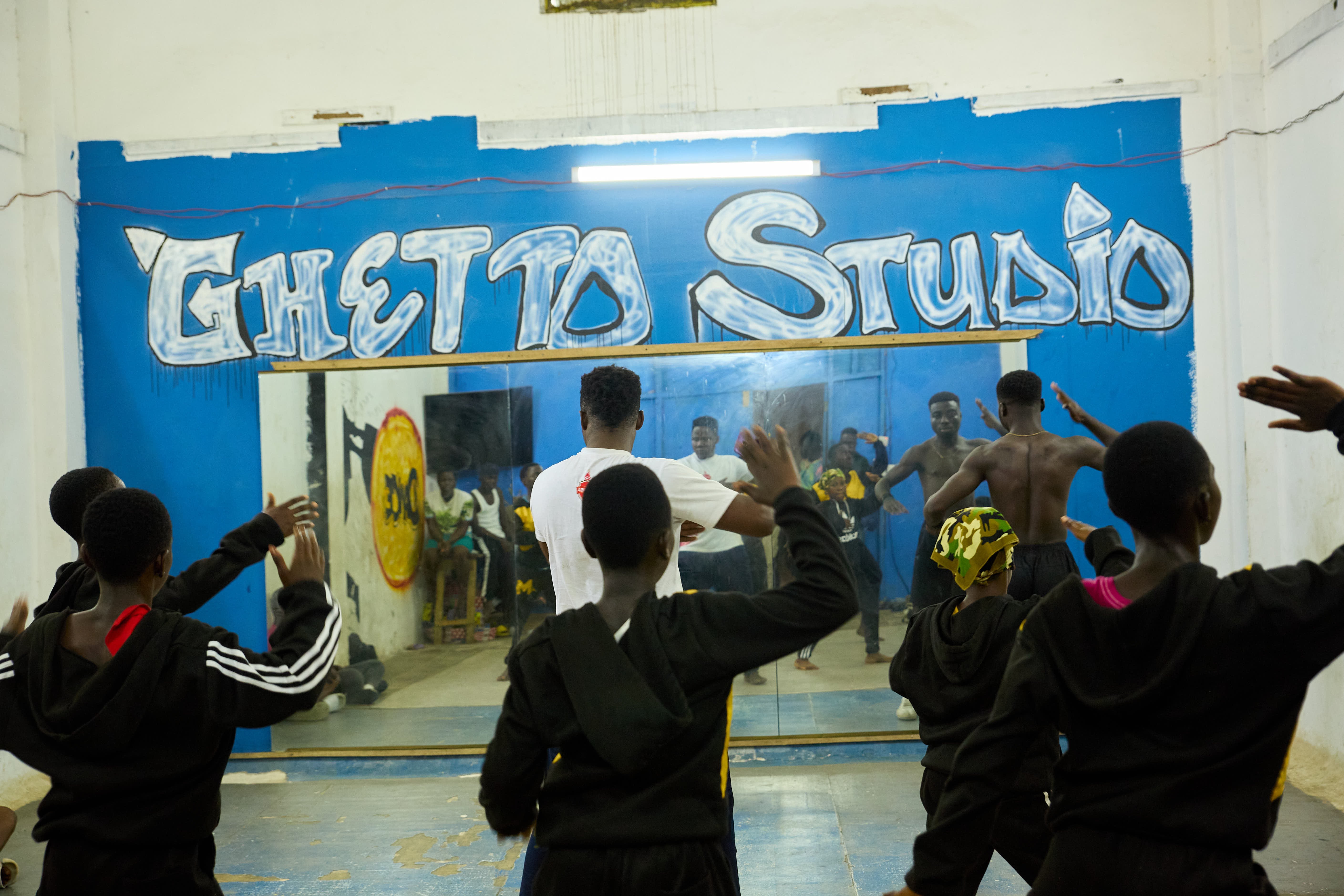 A group of children rehearsing at the Ghetto studio on a weekday.