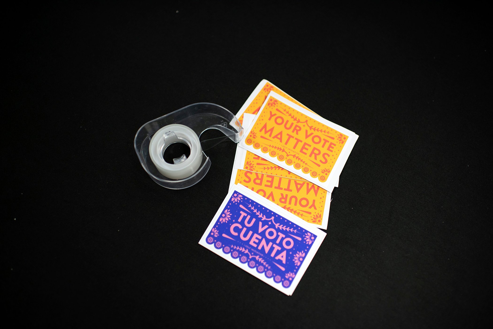 Stickers in Spanish and English and a roll of tape sit on a table at the headquarters of Jolt, a non-profit organization that works to increase the civic participation of Latinos in Texas, in Houston, Texas on Feb. 20, 2020.