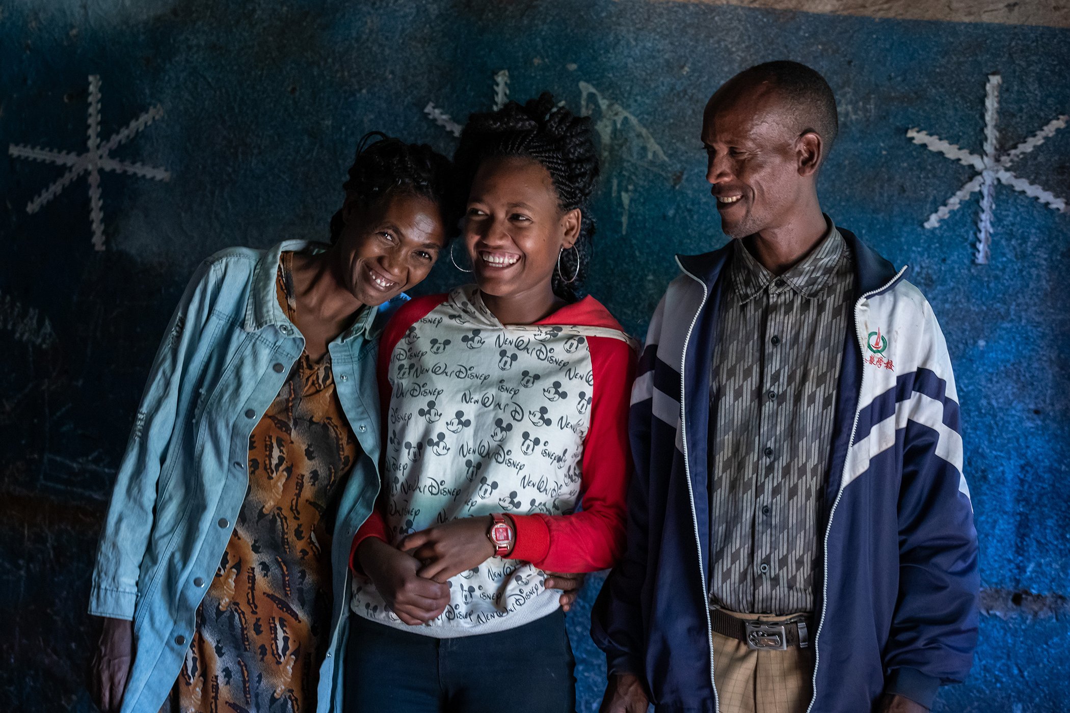 Tseganesh Dansa is photographed with her family in Kuto Ambe, Ethiopia. She is happy that her parents support her education and made sure that she didn't get married at a young age.